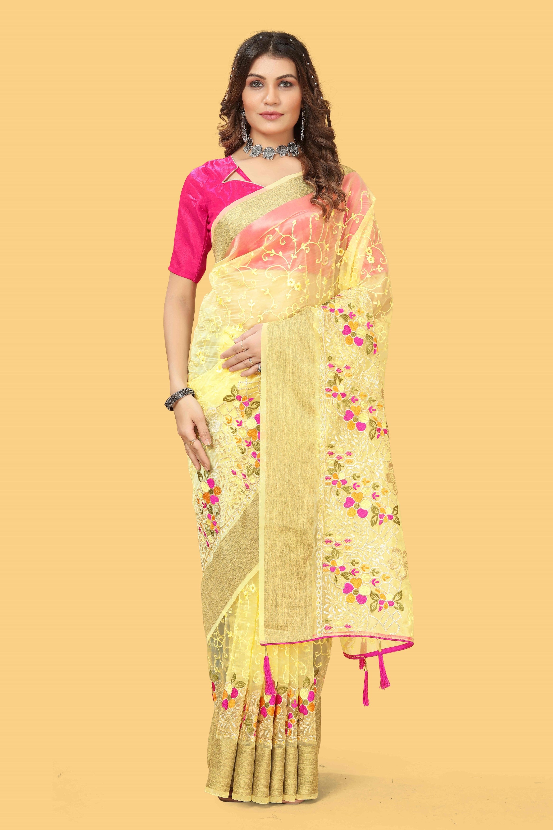 Floral embroidered organza silk saree with zari border, stone work, and contrast pink blouse