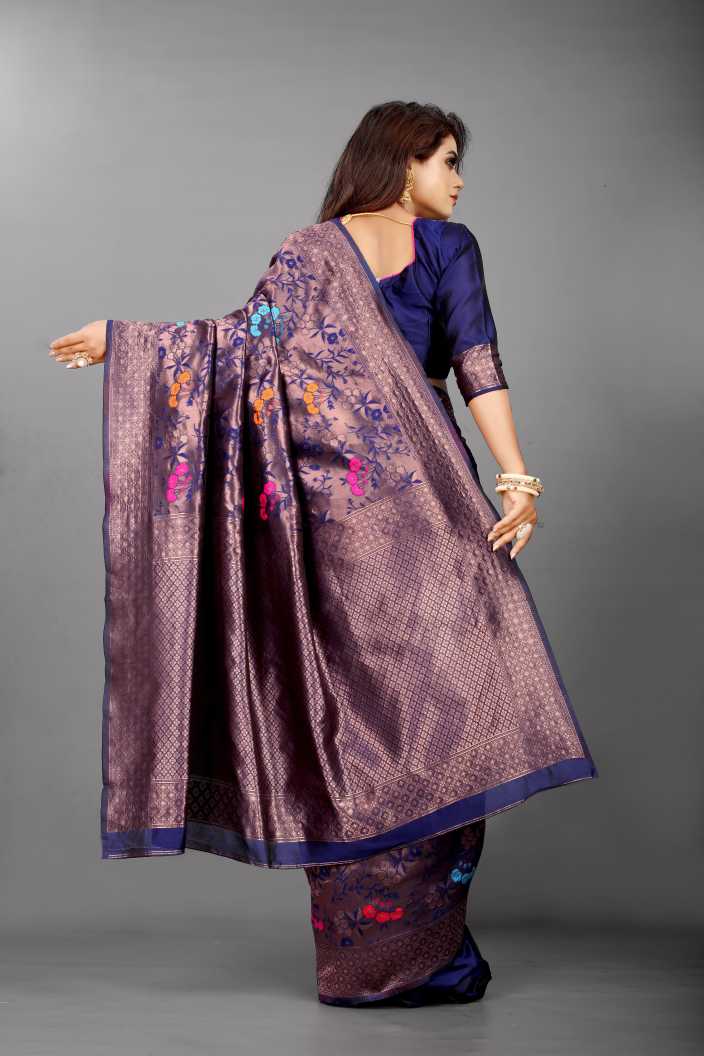 Mystical Soft Lichi Silk saree in shimmering midnight plum with an intricate self-weave pattern, featuring delicate multi-colour floral motifs and a rich zari border, gracefully worn by a model.