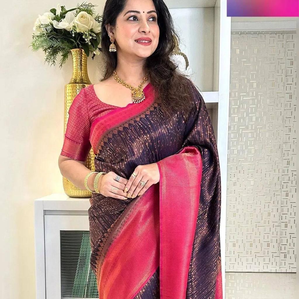 Banarasi Silk saree collection featuring intricate gold zari weaving and heavy border detailing; available exclusively in two signature colors: deep maroon and festive gold.