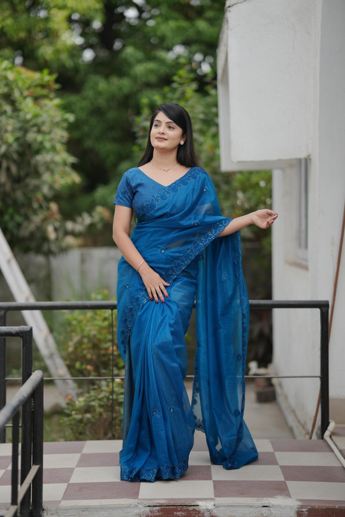twill net saree with multicolor thread sequins embroidery and cutwork border