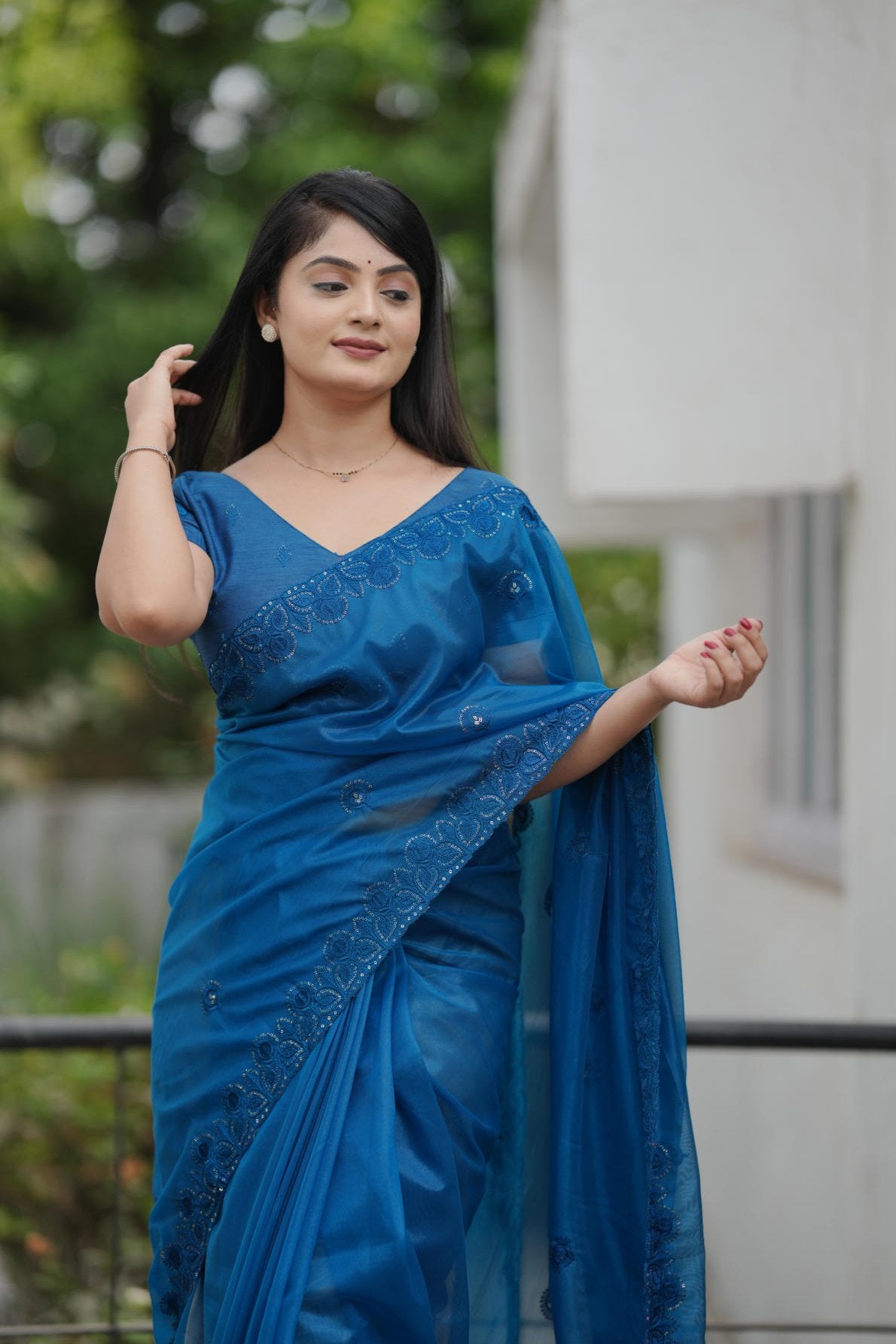 twill net saree with multicolor thread sequins embroidery and cutwork border