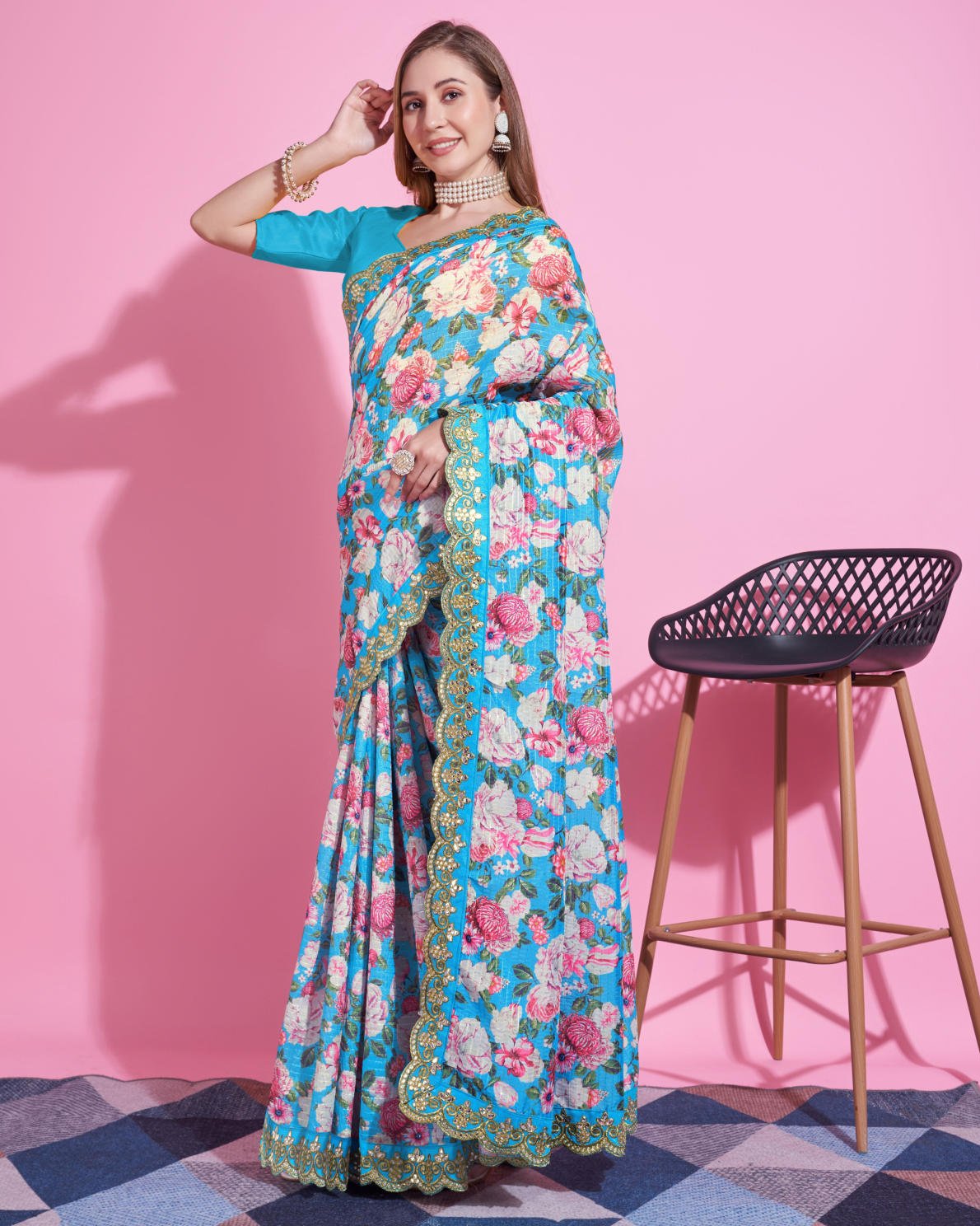 Yellow Vichitra Silk Saree with floral digital print and Zari Dori embroidered border worn by model holding white handbag