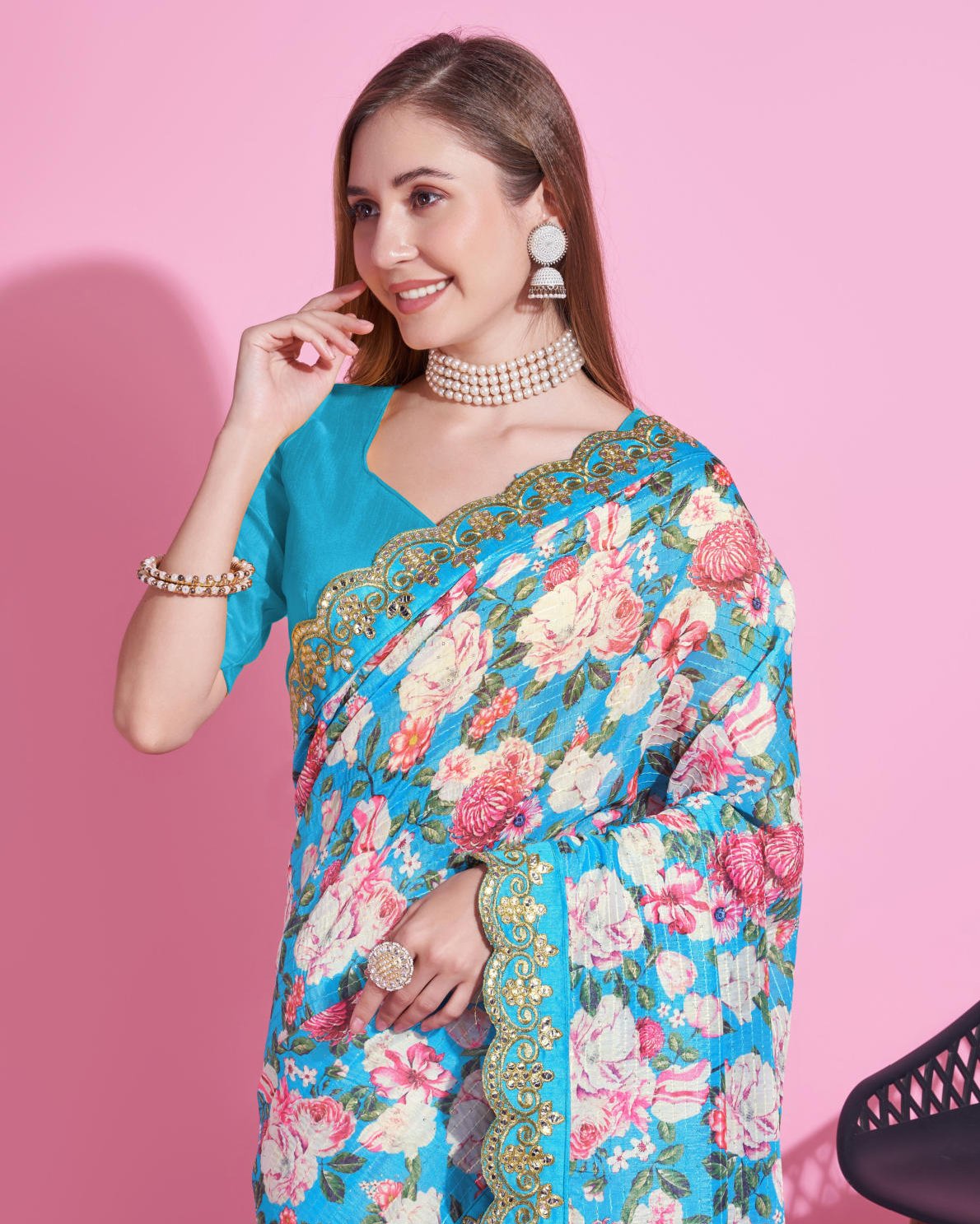 Yellow Vichitra Silk Saree with floral digital print and Zari Dori embroidered border worn by model holding white handbag