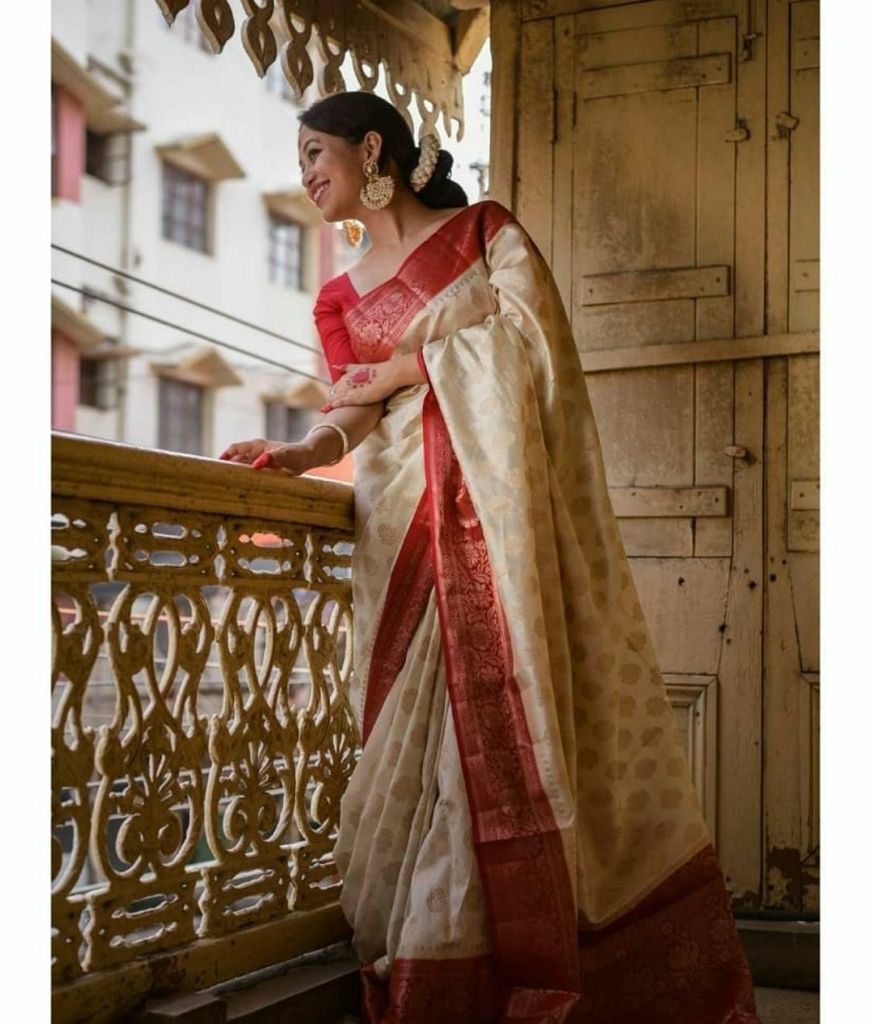 Luxurious Soft Lichi Silk saree collection with a liquid drape and fine zari weaving; available in four soul-stirring jewel tones, offering poetic elegance and a comfortable feel.
