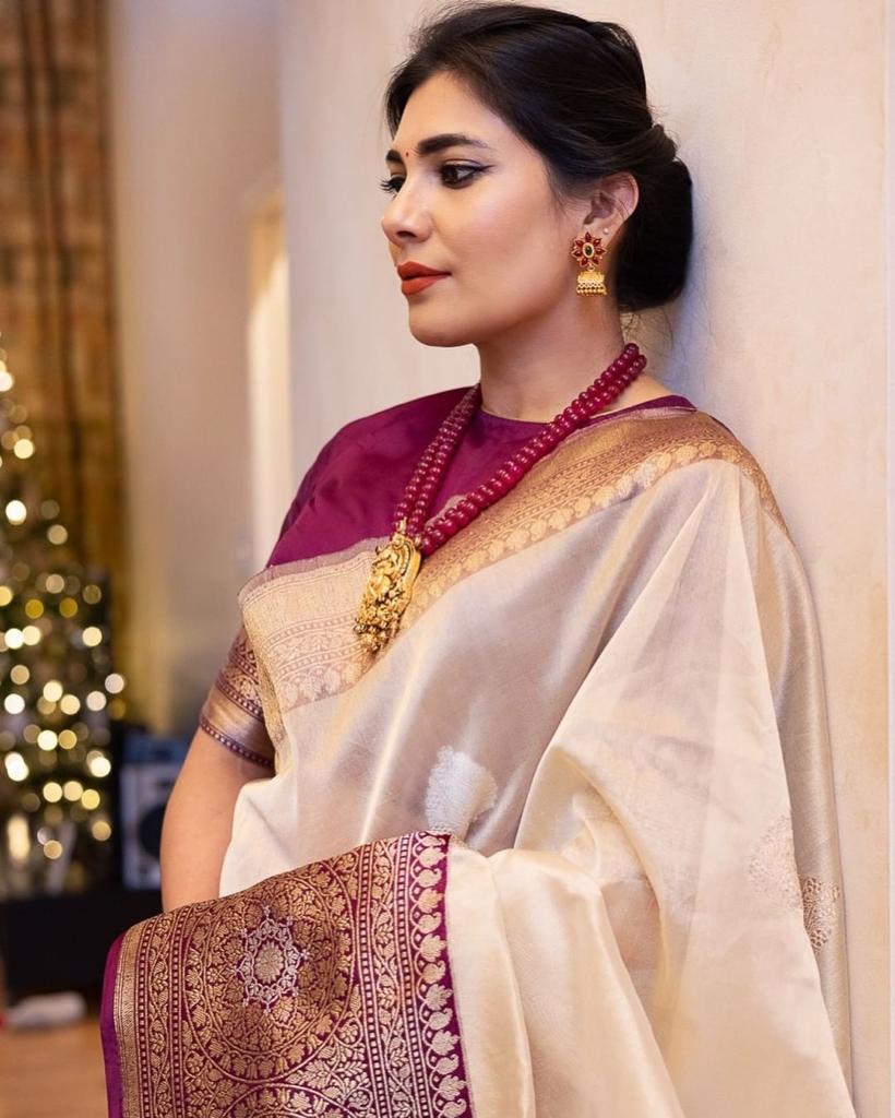 Elegant purple Banarasi soft silk saree with intricate gold zari border and rich pallu design.