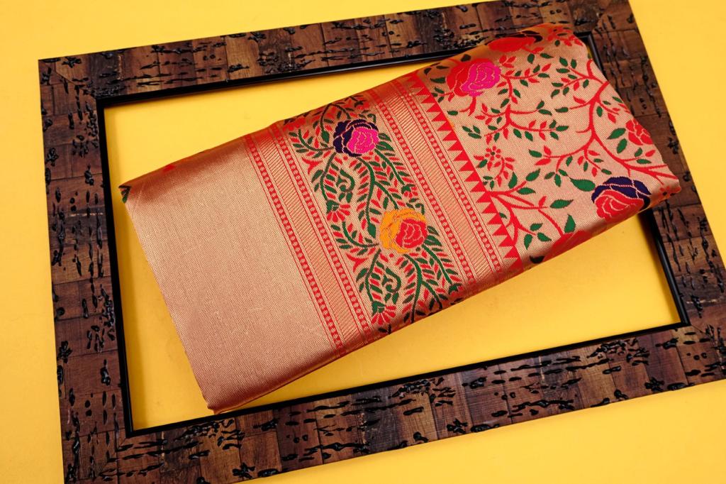 Exquisite Soft Lichi Silk Paithani saree in luminous golden beige, featuring scattered multi-colour floral motifs on the body and a magnificent pallu with vibrant floral tree designs, elegantly draped with a red border.