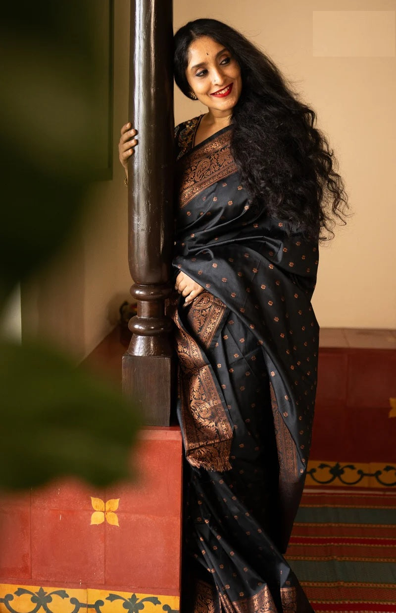 Premium Banarasi silk with copper zari accents