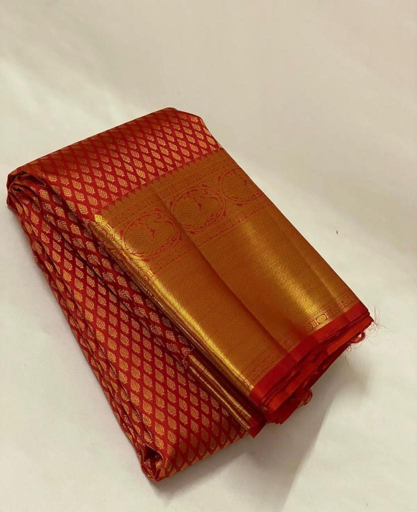 Folded red and gold fabric on a white background