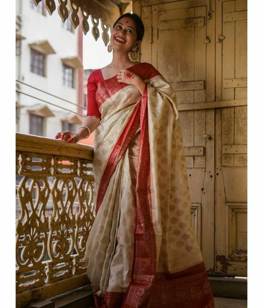 Luxurious Soft Lichi Silk saree collection with a liquid drape and fine zari weaving; available in four soul-stirring jewel tones, offering poetic elegance and a comfortable feel.