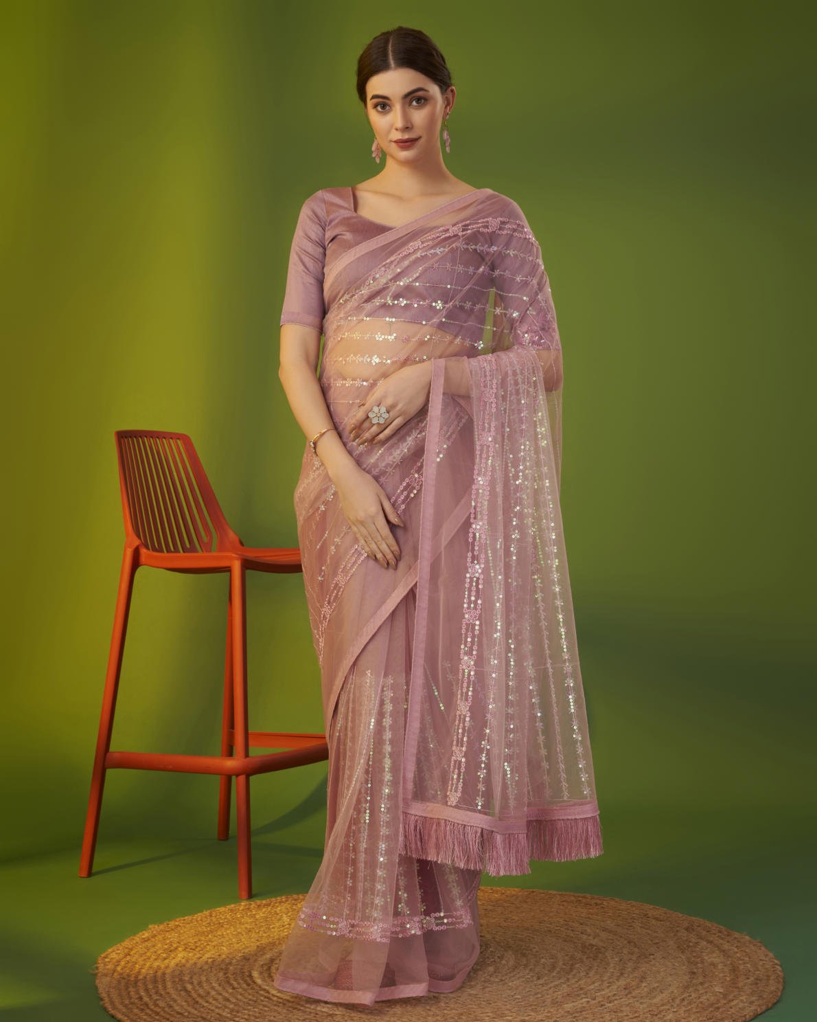 Mauve heavy butterfly net saree with 5mm sequence embroidery and tassel border worn by model