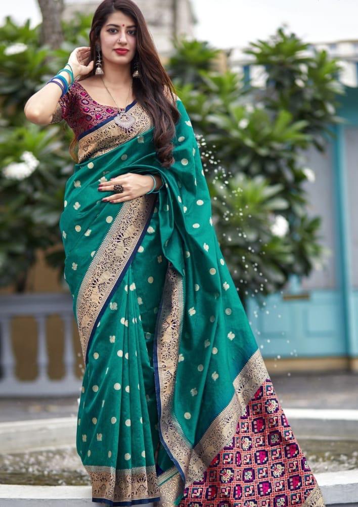 Luminous Soft Lichi Silk saree in vibrant deep magenta, featuring a subtle self-weave texture and a wide, opulent border intricately woven with lustrous gold zari, elegantly photographed as a flat product shot.