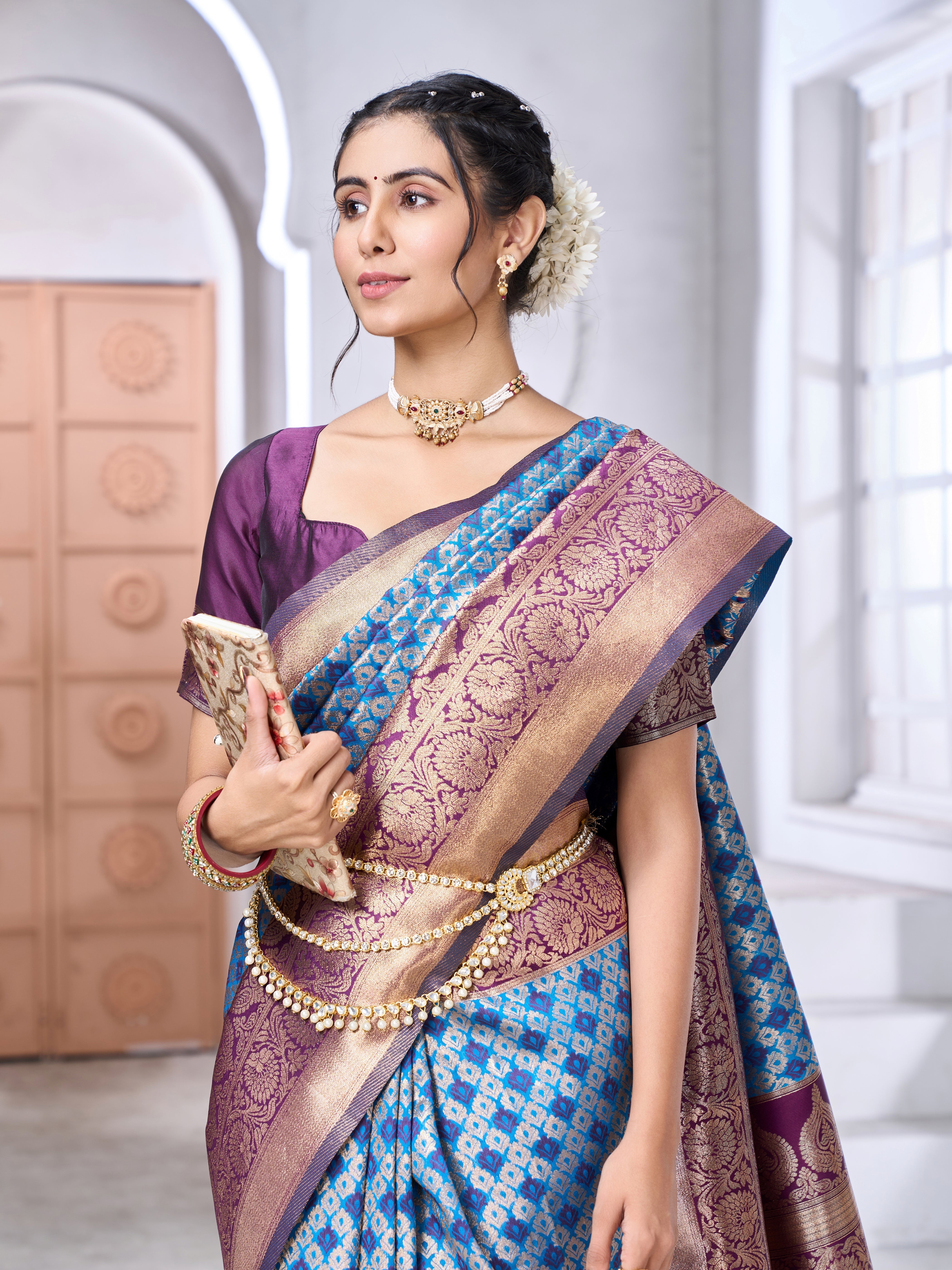 Banarasi soft silk saree in subtle tone with gold zari weaving worn by model outdoors