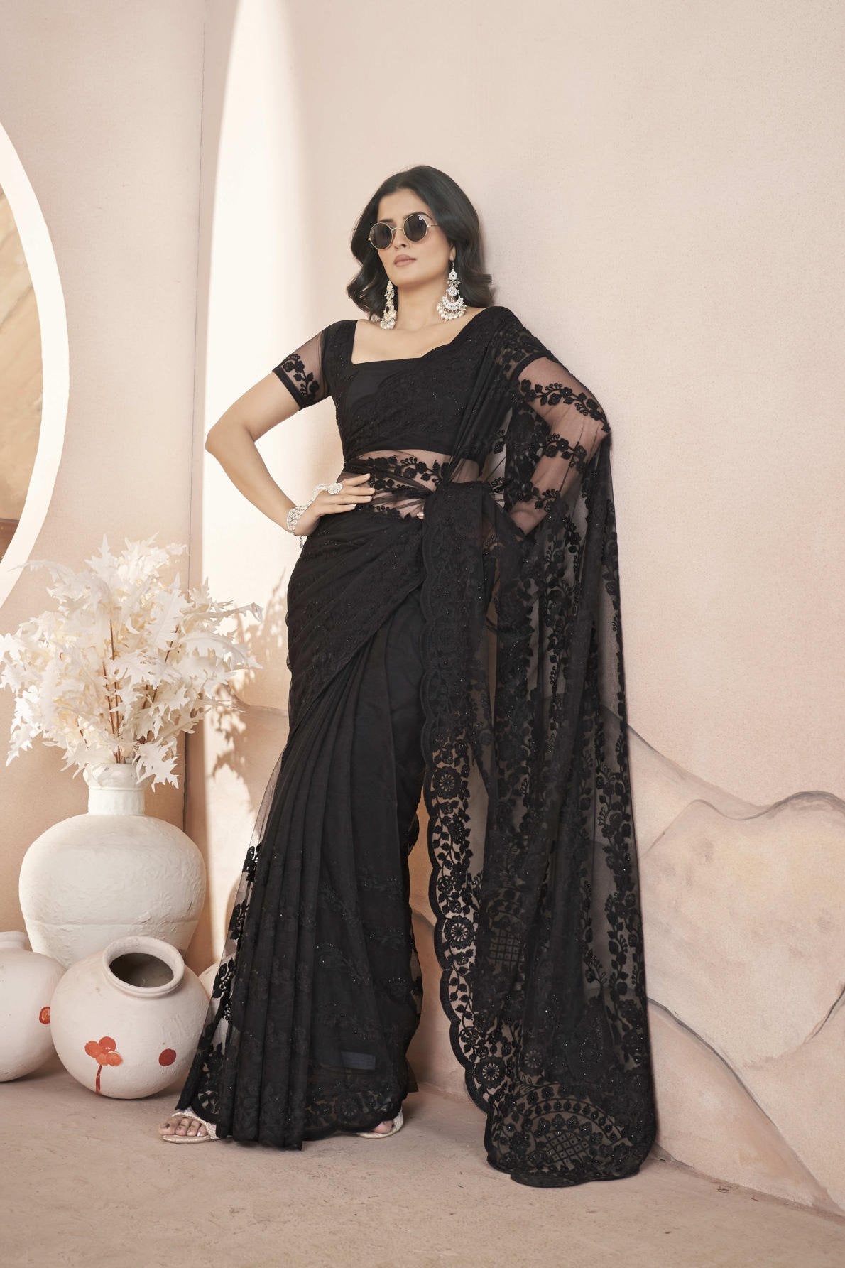 heavy butterfly net saree with tone to tone aari embroidery stone work and rich pallu with embroidered blouse