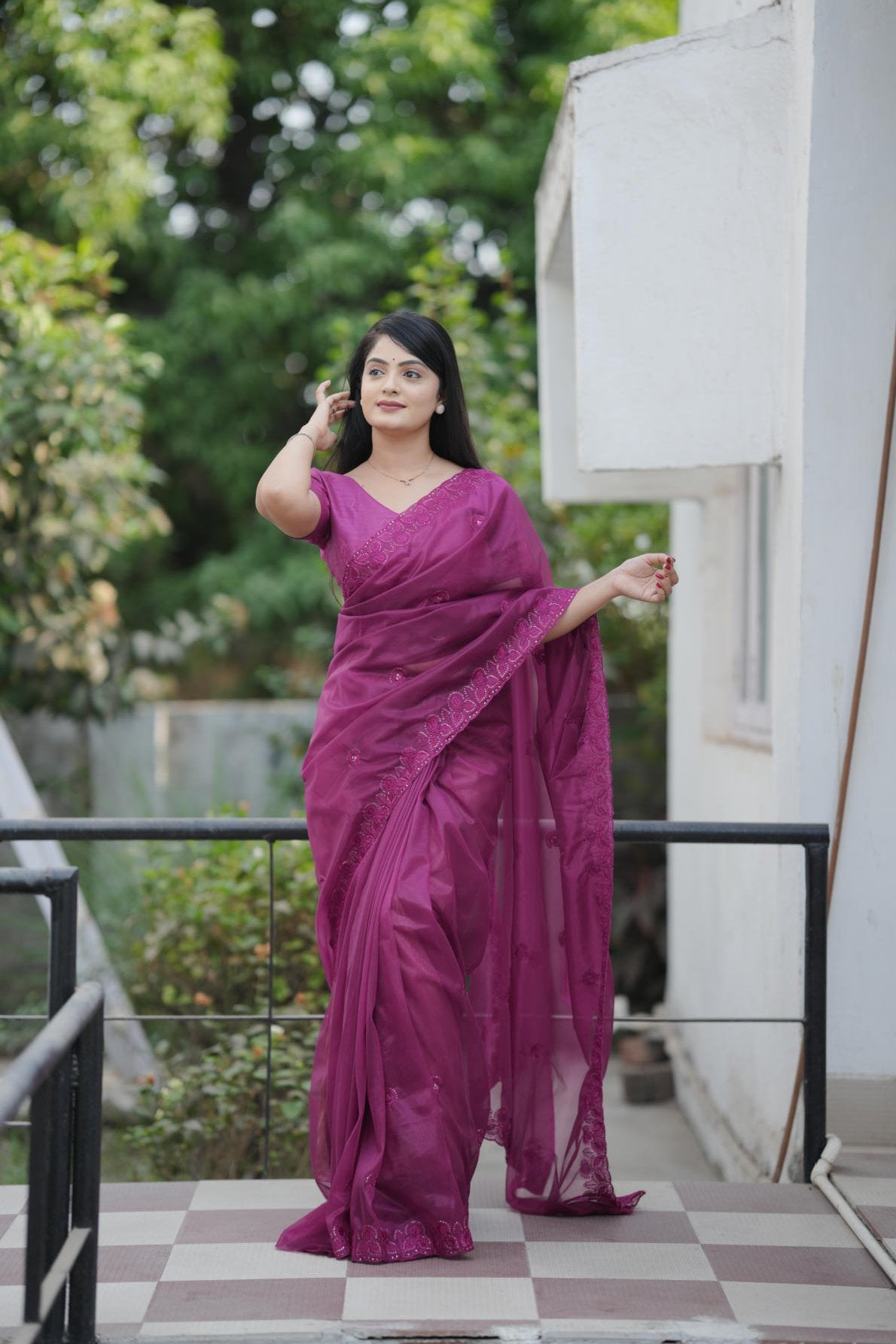 twill net saree with multicolor thread sequins embroidery and cutwork border