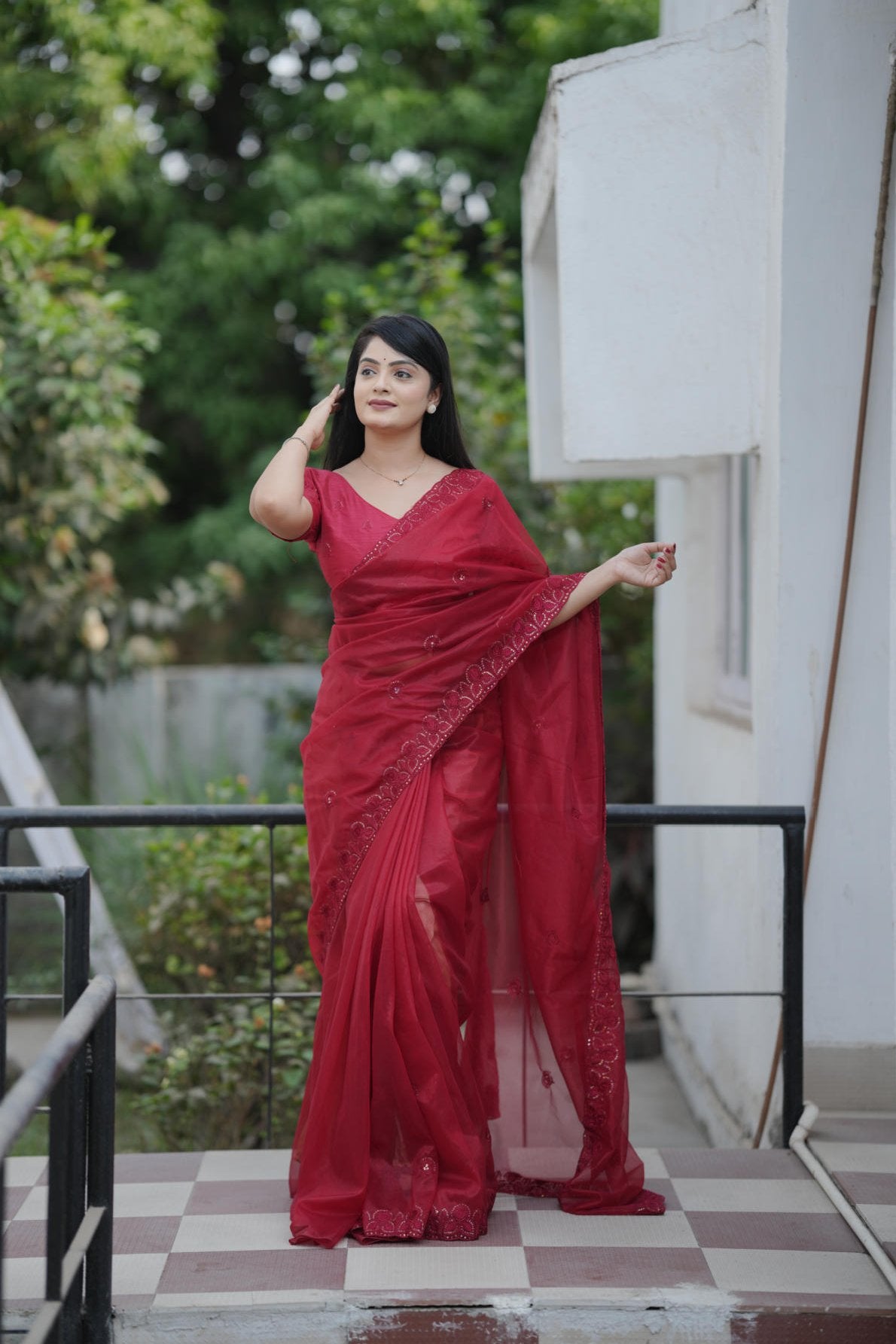 twill net saree with multicolor thread sequins embroidery and cutwork border