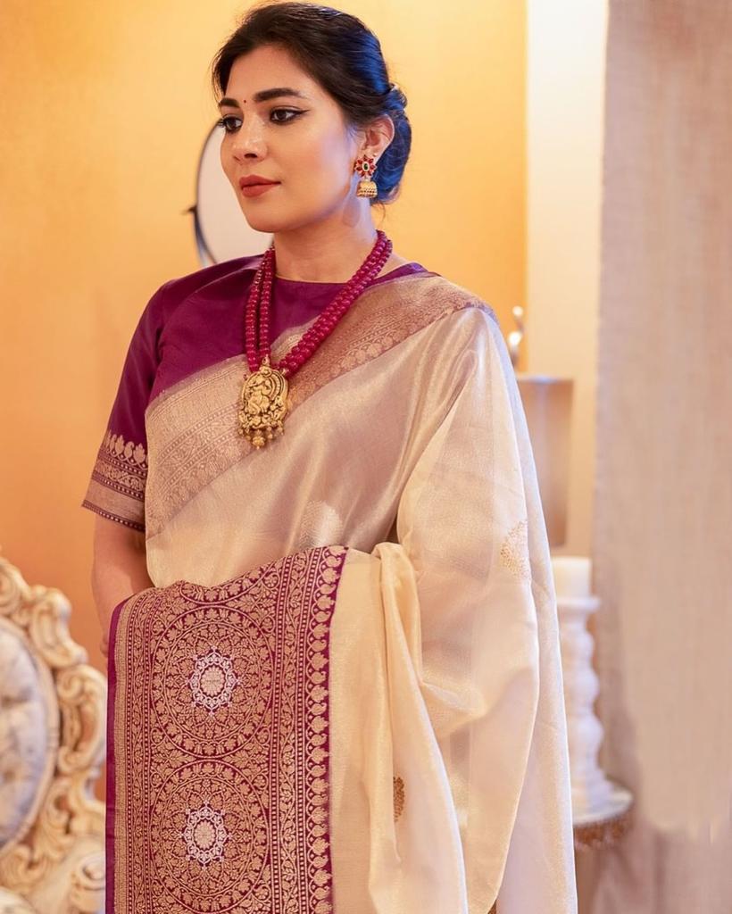 Elegant purple Banarasi soft silk saree with intricate gold zari border and rich pallu design.