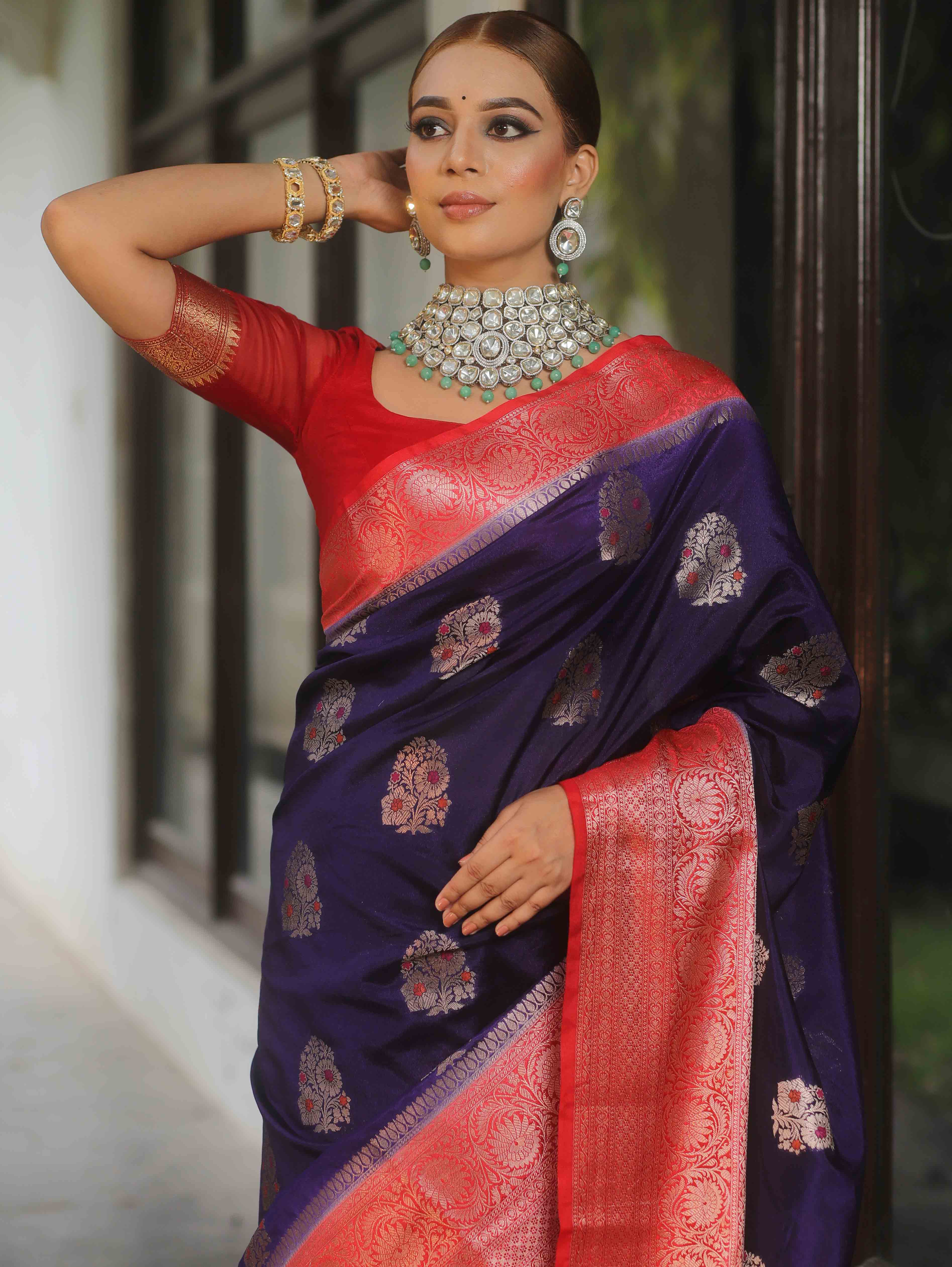 Banarasi silk saree navy blue with red border and gold-silver zari motifs worn by model
