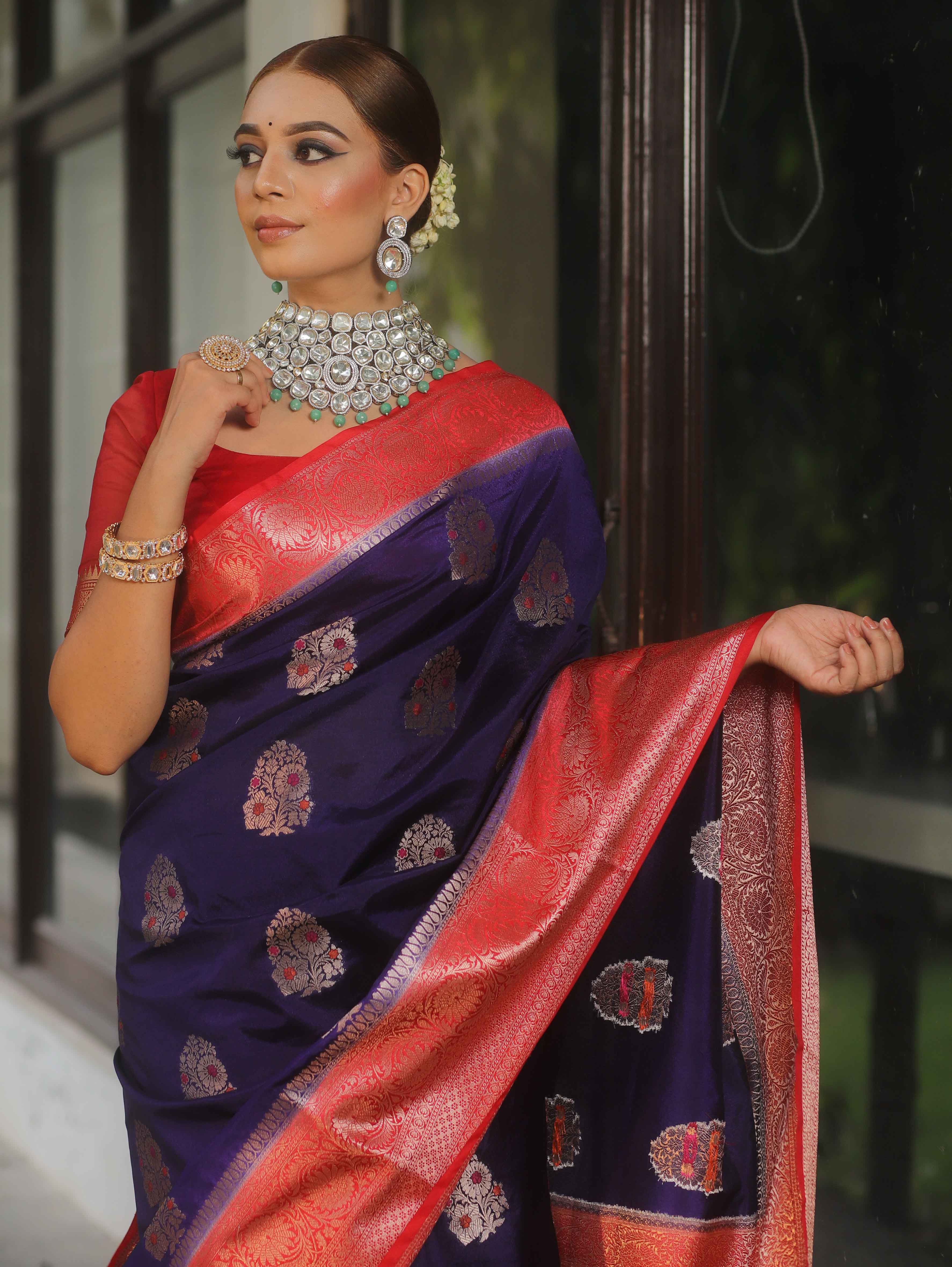 Banarasi silk saree navy blue with red border and gold-silver zari motifs worn by model
