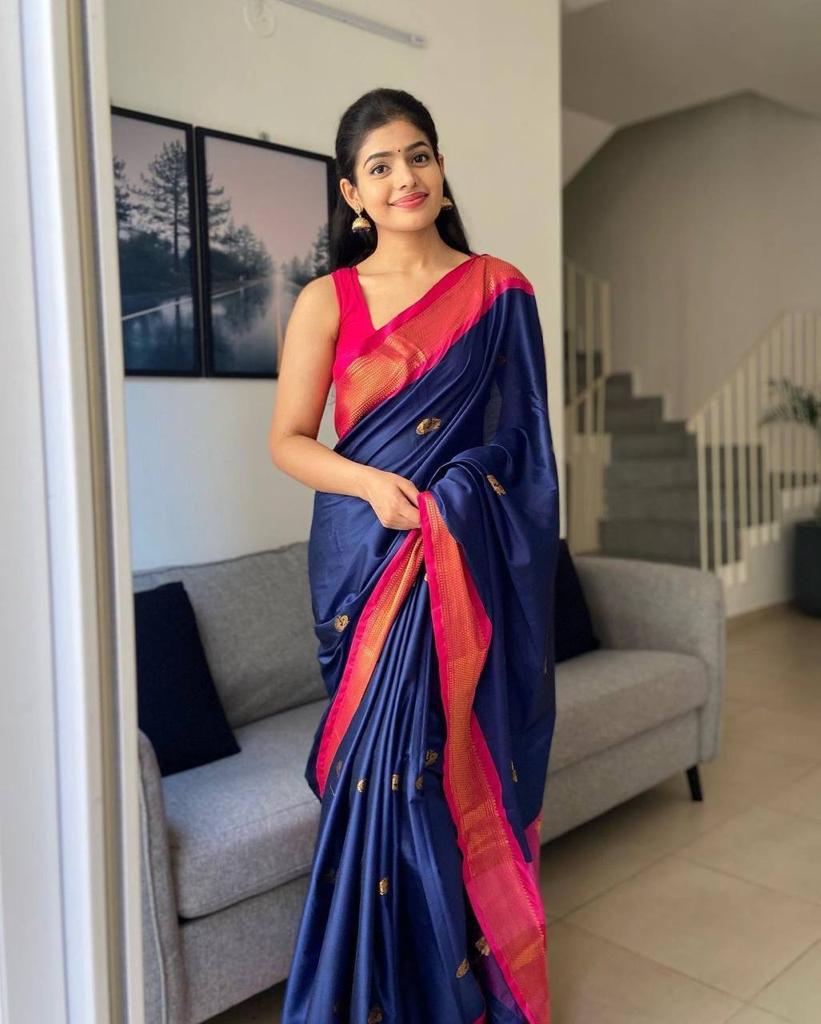 Banarasi Silk saree featuring a shimmering texture and wide gold zari contrast border; available in 4 vibrant colors including bright BLUE.
