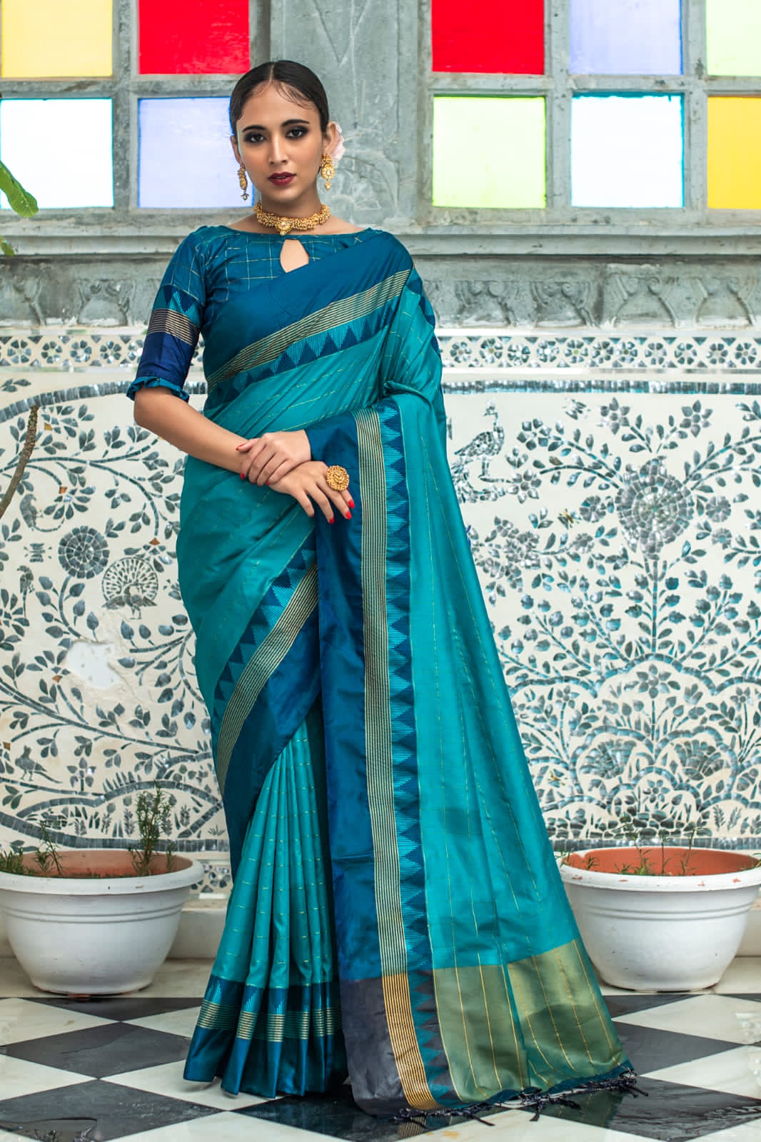 Celestial Banarasi Soft Silk saree collection with a fluid drape and fine zari weaving; available in seven majestic colors, offering a spectrum of luxurious hues for grand occasions.