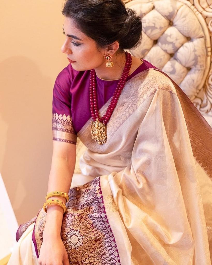 Elegant purple Banarasi soft silk saree with intricate gold zari border and rich pallu design.