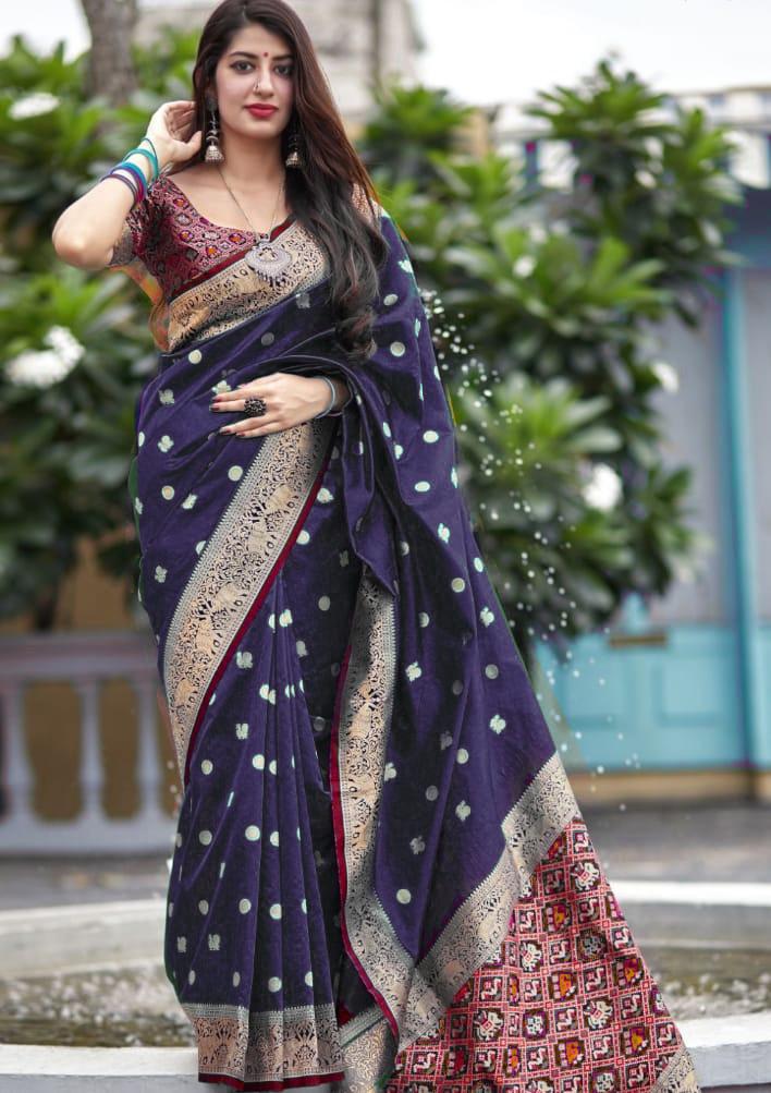 Luminous Soft Lichi Silk saree in vibrant deep magenta, featuring a subtle self-weave texture and a wide, opulent border intricately woven with lustrous gold zari, elegantly photographed as a flat product shot.