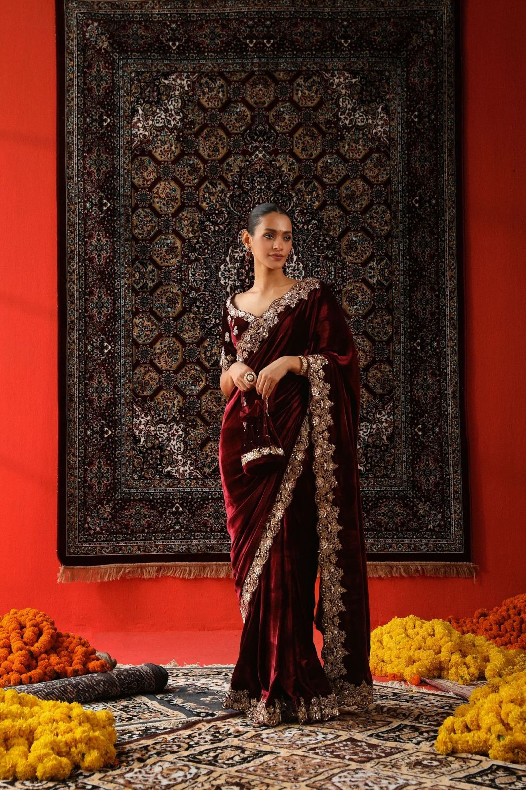 Model wearing luxurious 9000 velvet saree with silver sequence and zari embroidery cutwork border for wedding reception