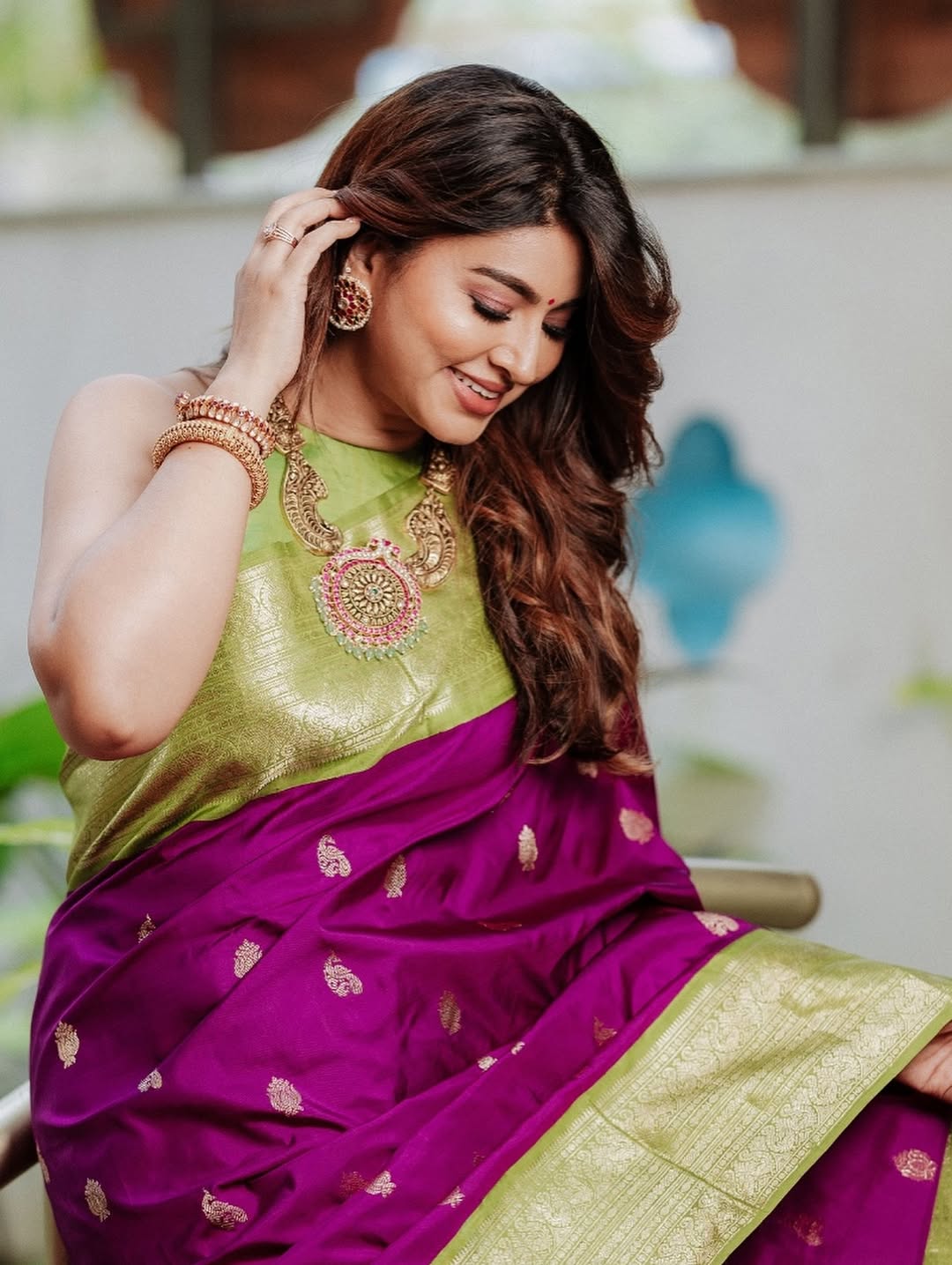 Pista green Banarasi soft silk saree with elegant woven detailing and smooth finish