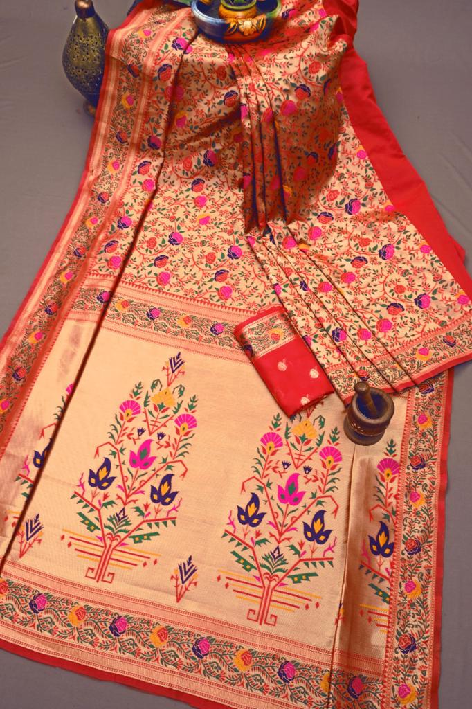 Exquisite Soft Lichi Silk Paithani saree in luminous golden beige, featuring scattered multi-colour floral motifs on the body and a magnificent pallu with vibrant floral tree designs, elegantly draped with a red border.