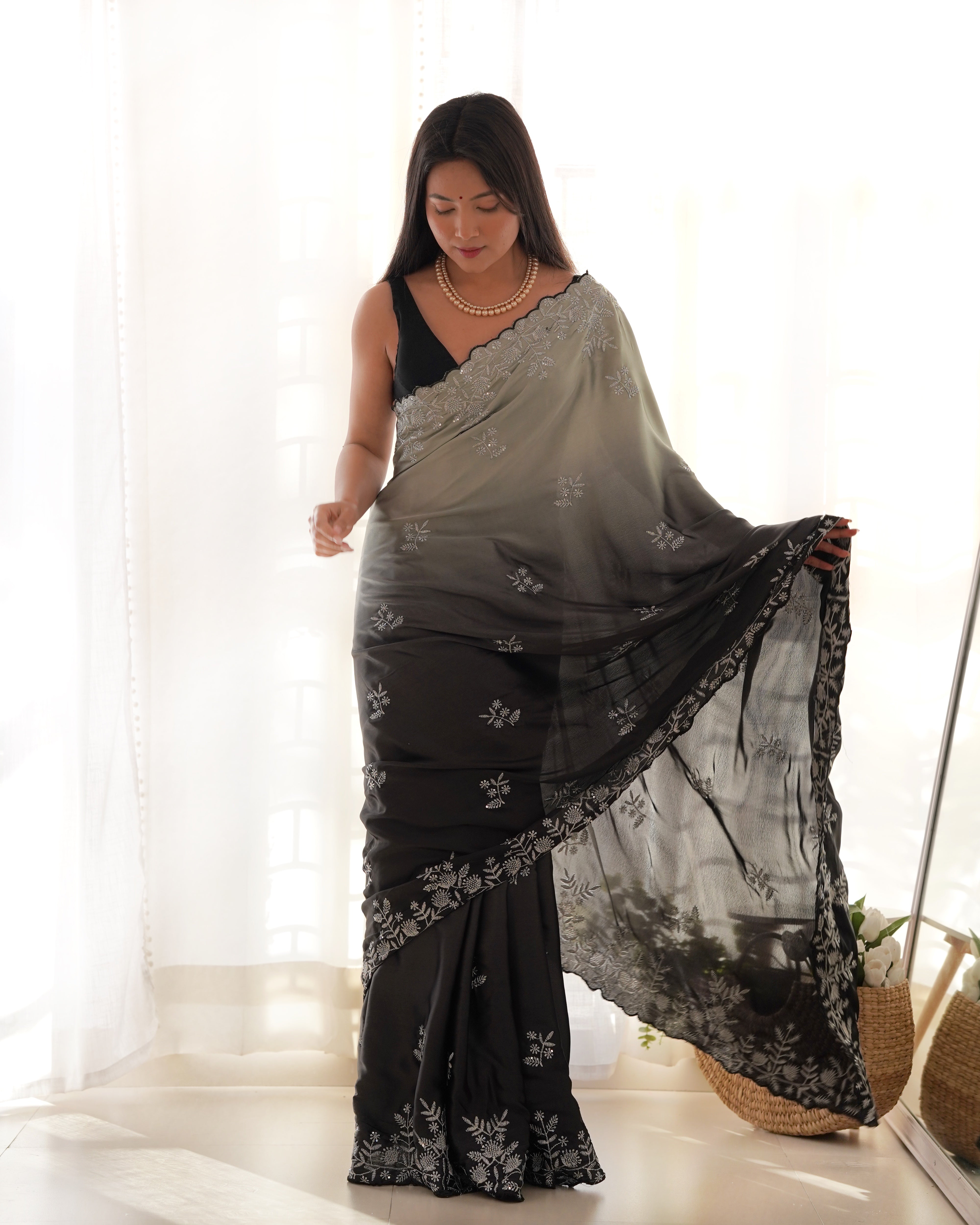 Grey and black ombre heavy Japan satin saree with intricate zari dori and sequence embroidery worn by a model
