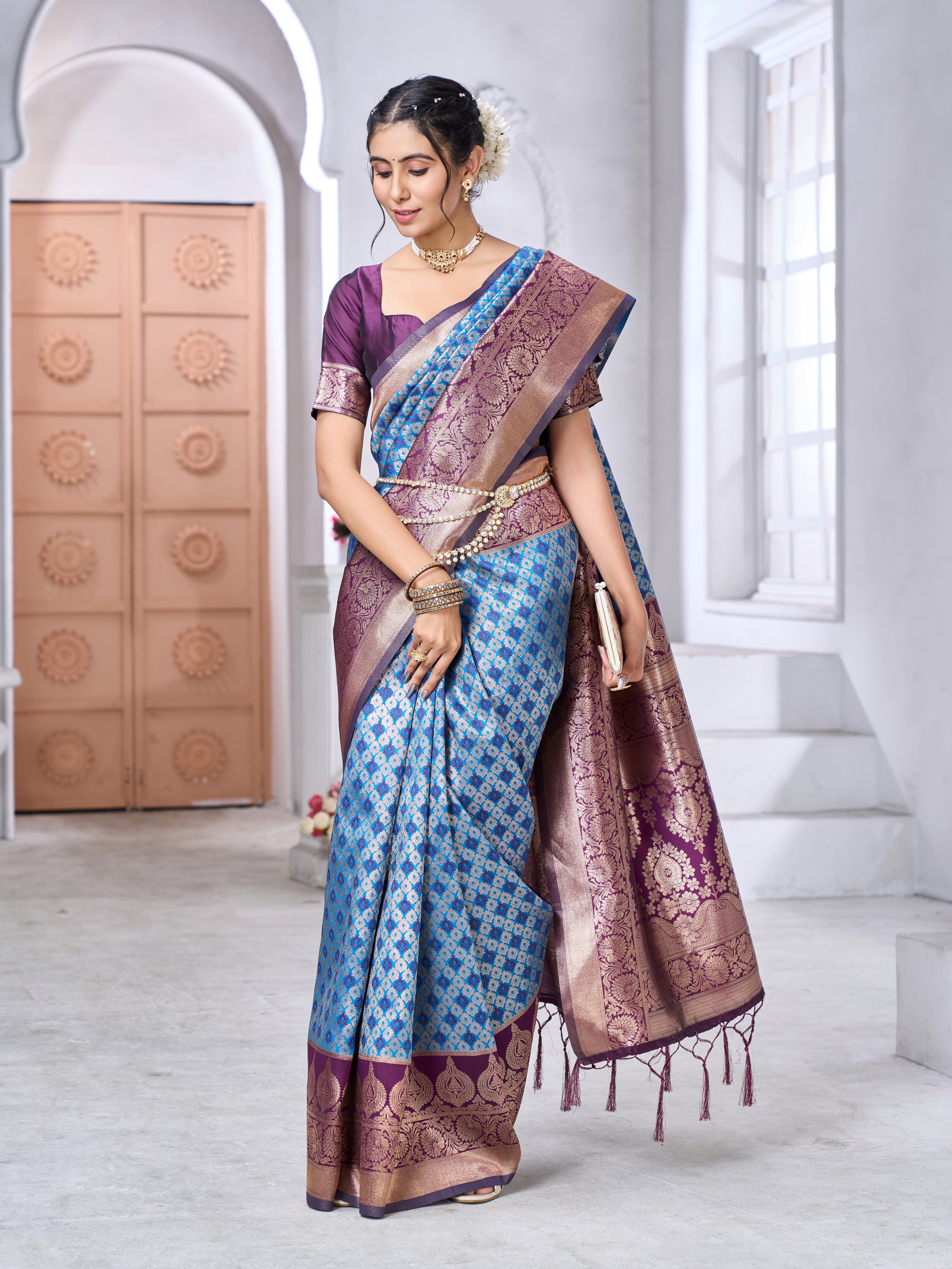 Banarasi soft silk saree in subtle tone with gold zari weaving worn by model outdoors