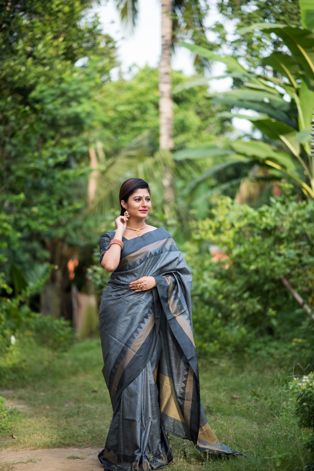 Celestial Banarasi Soft Silk saree collection with a fluid drape and fine zari weaving; available in seven majestic colors, offering a spectrum of luxurious hues for grand occasions.