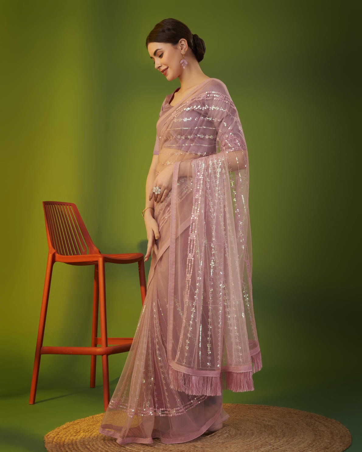 Mauve heavy butterfly net saree with 5mm sequence embroidery and tassel border worn by model