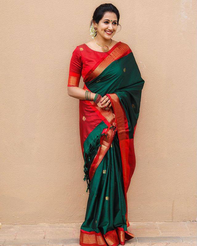 Banarasi Silk saree featuring a shimmering texture and wide gold zari contrast border; available in 4 vibrant colors including bright GREEN.