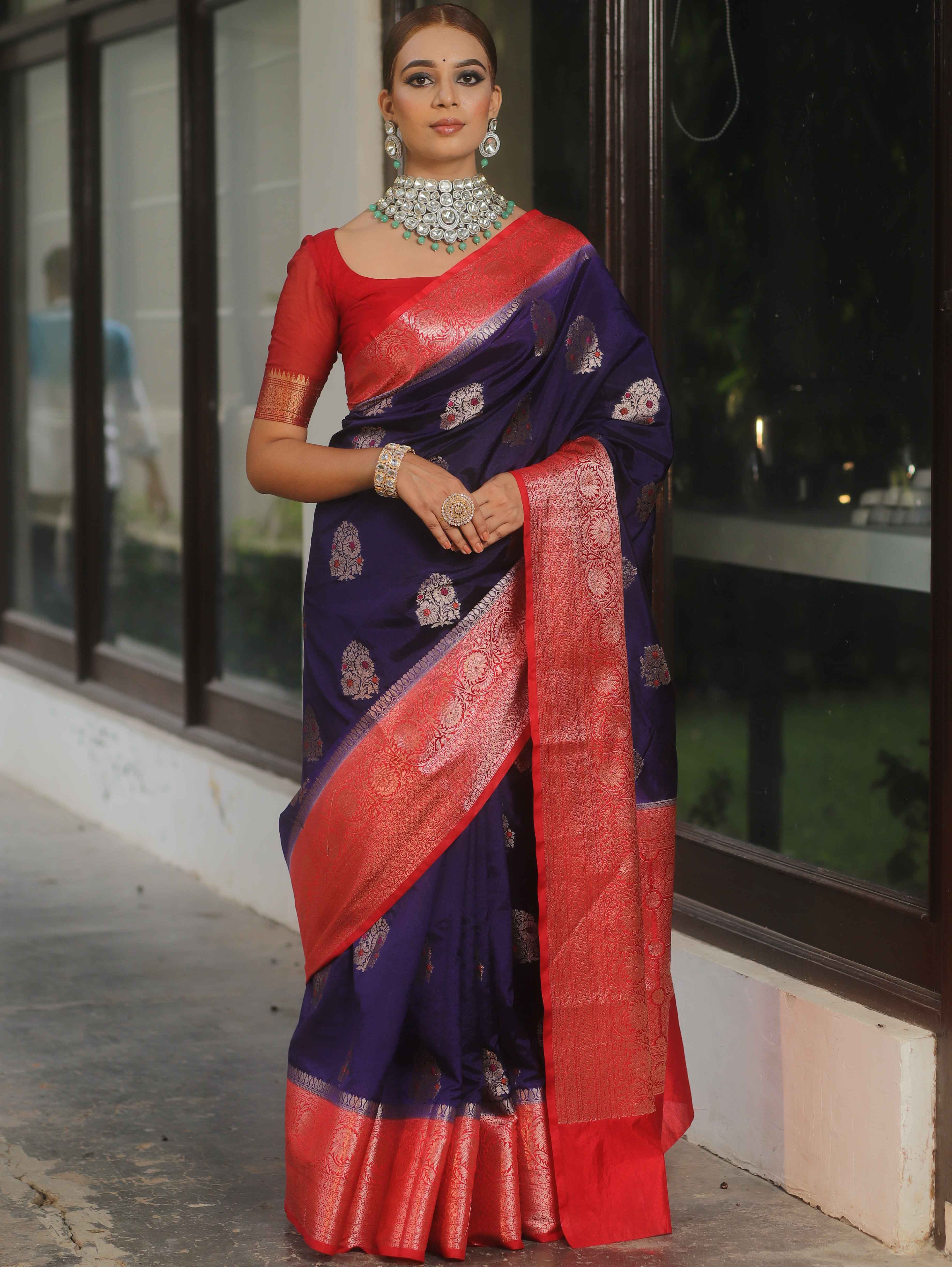 Banarasi silk saree navy blue with red border and gold-silver zari motifs worn by model