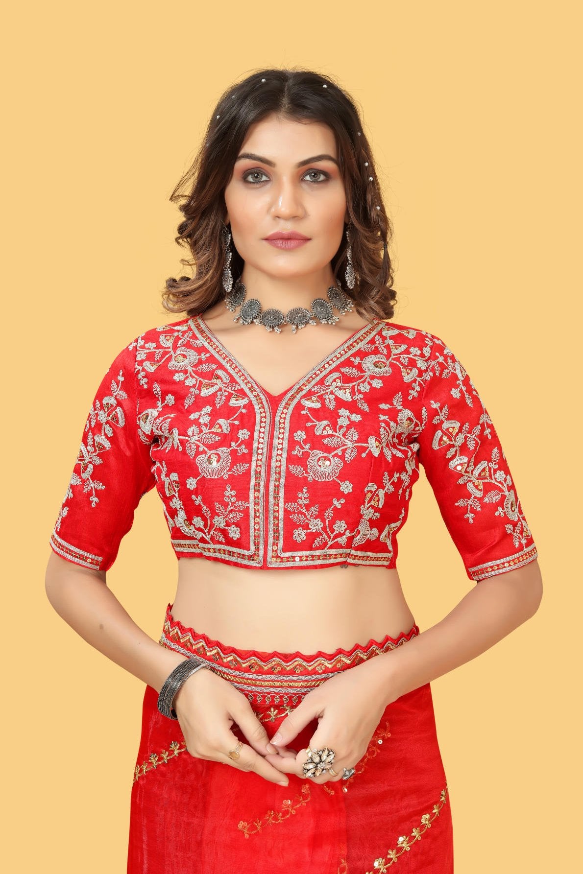 Red organza silk saree with heavy zari and sequence embroidery work worn by model for wedding party