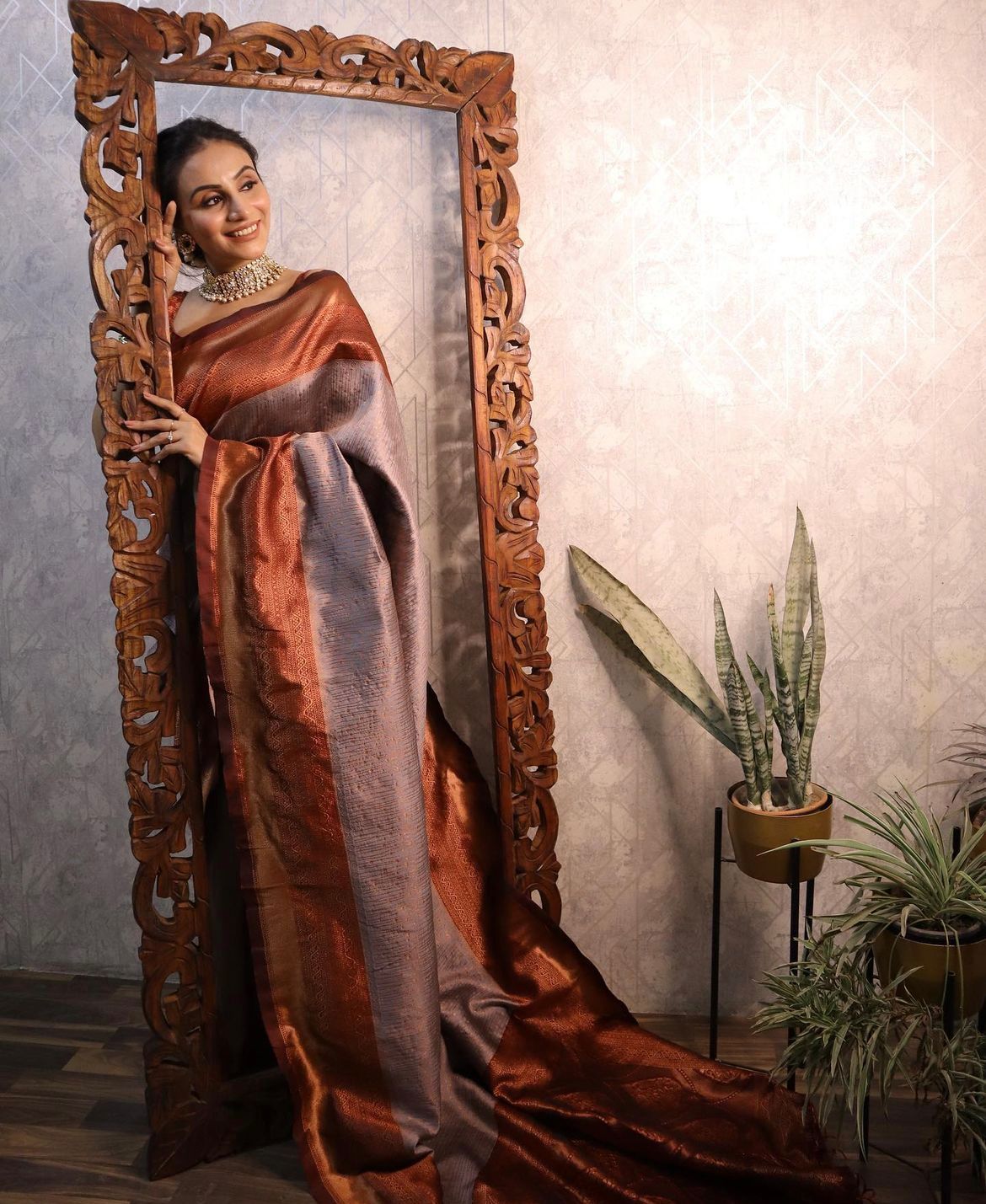 Banarasi Silk saree collection featuring intricate gold zari weaving and heavy border detailing; available exclusively in two signature colors: deep maroon and festive gold.