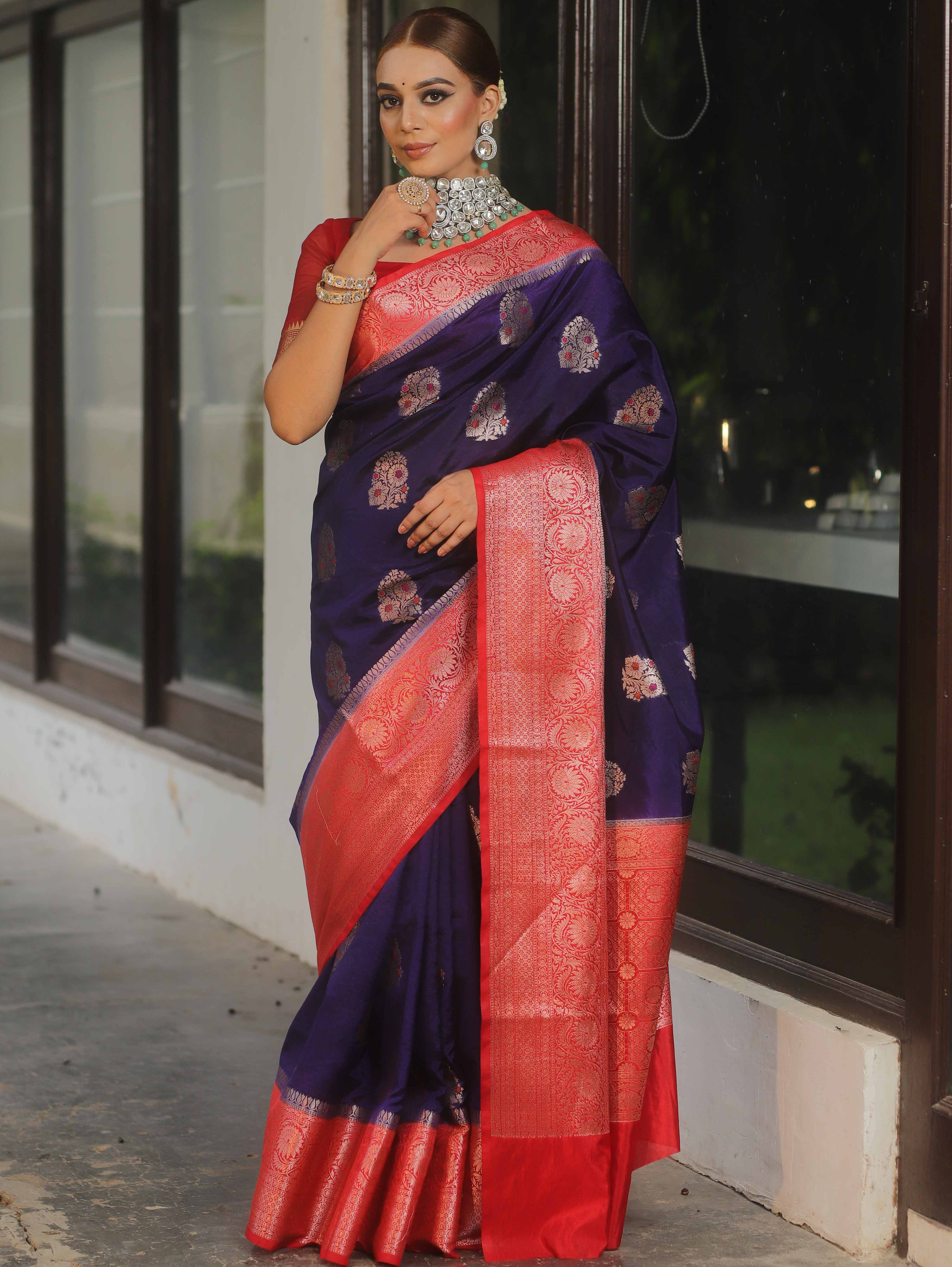 Banarasi silk saree navy blue with red border and gold-silver zari motifs worn by model