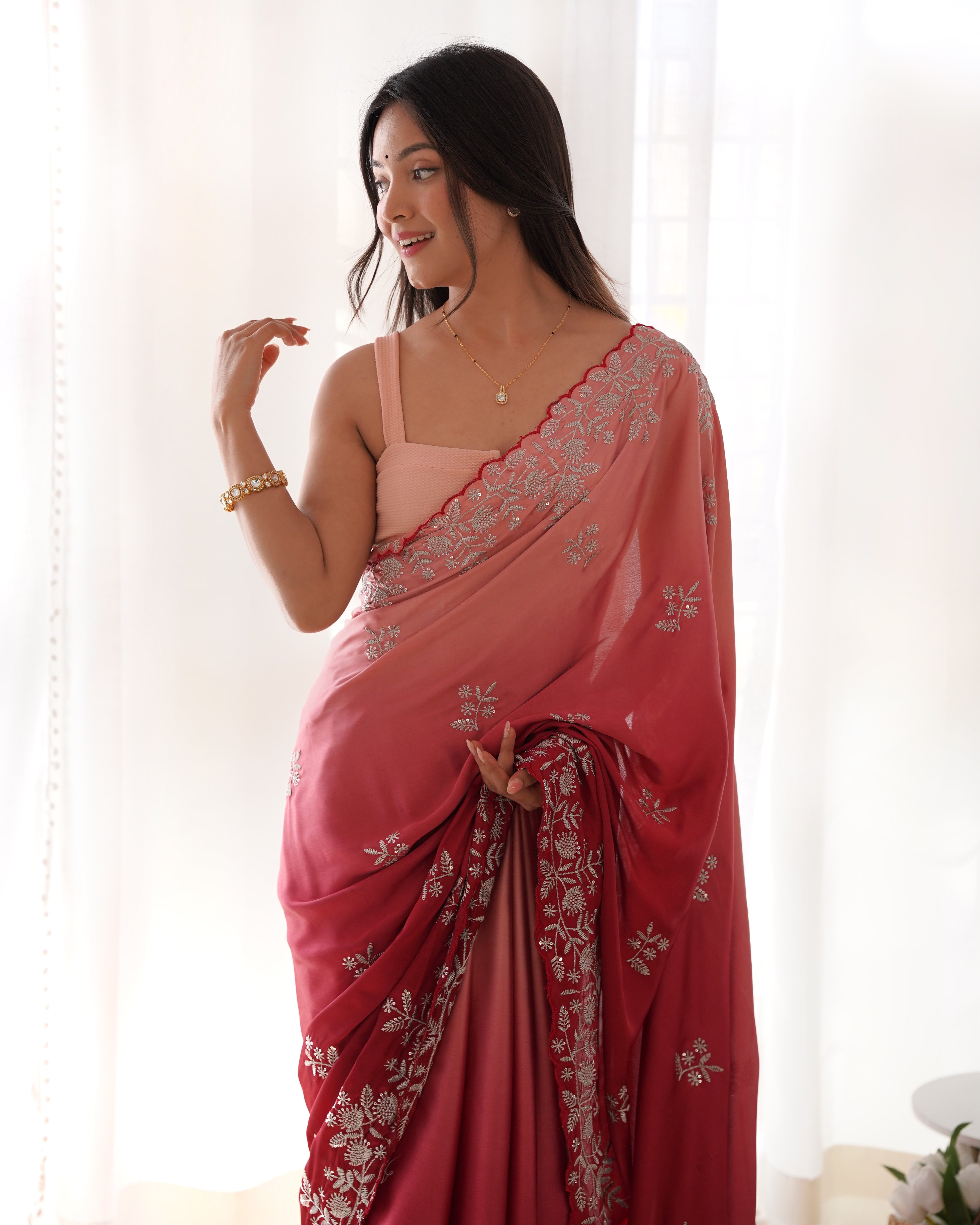 Grey and black ombre heavy Japan satin saree with intricate zari dori and sequence embroidery worn by a model