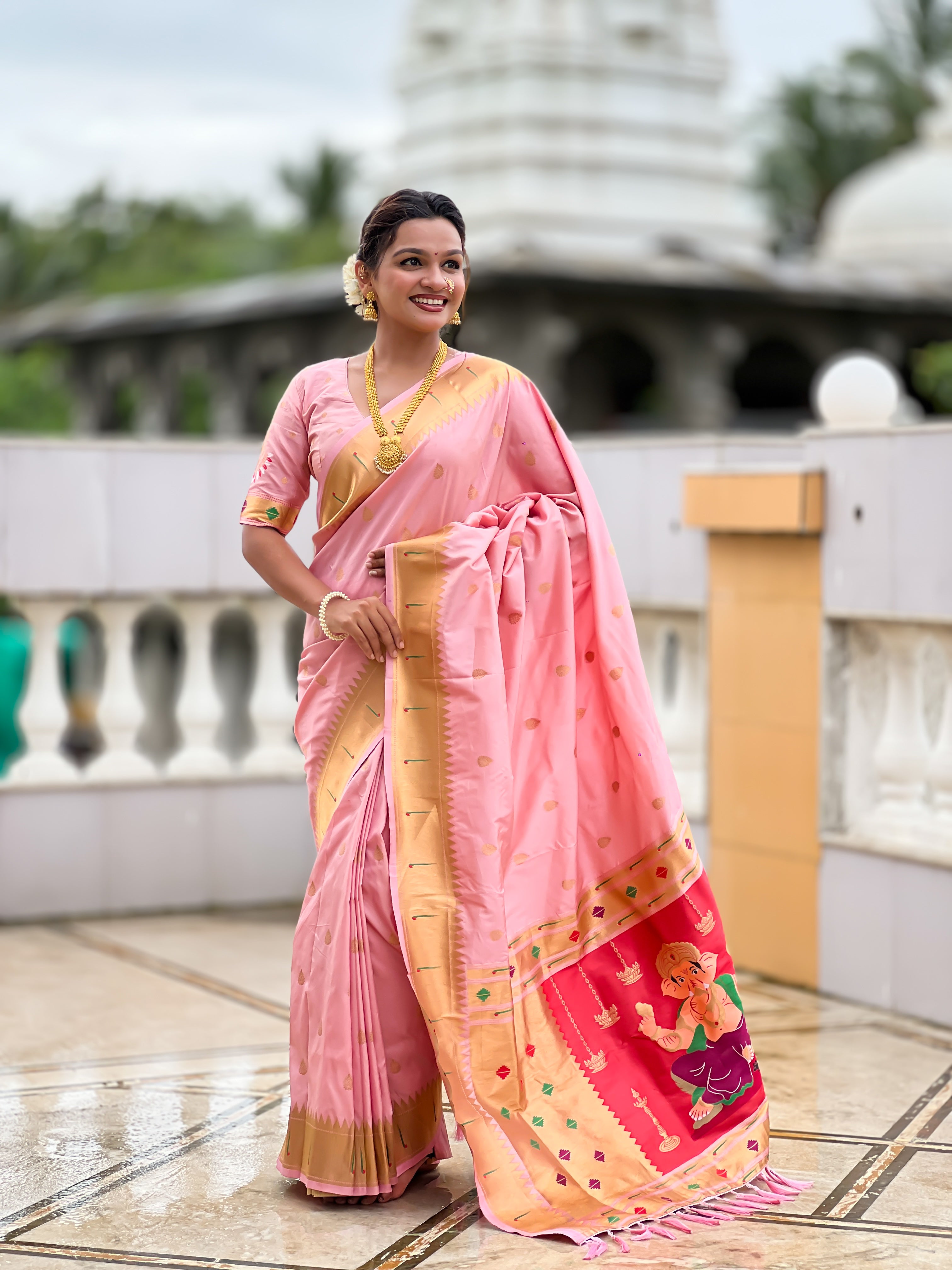 Soft Paithani Silk Saree; Pure Paithani Zari Weaving Motifs; Rich Meenakari Woven Pallu; Traditional Munia Border; Tassels on Pallu; Contrast Woven Silk Blouse with Sleeve Border