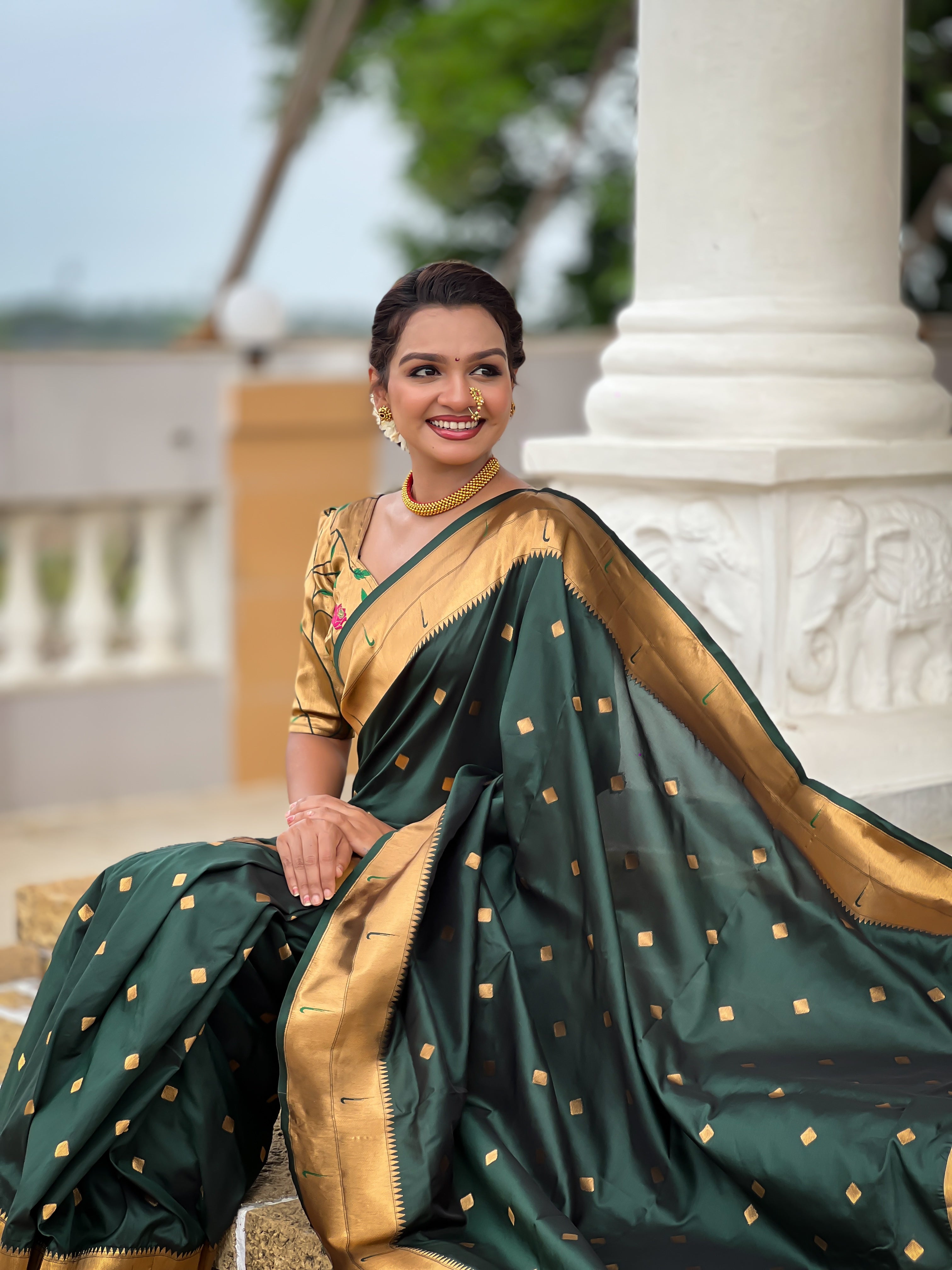 Woman wearing majestic Soft Paithani Silk Saree with Meenakari weaving and double munia border