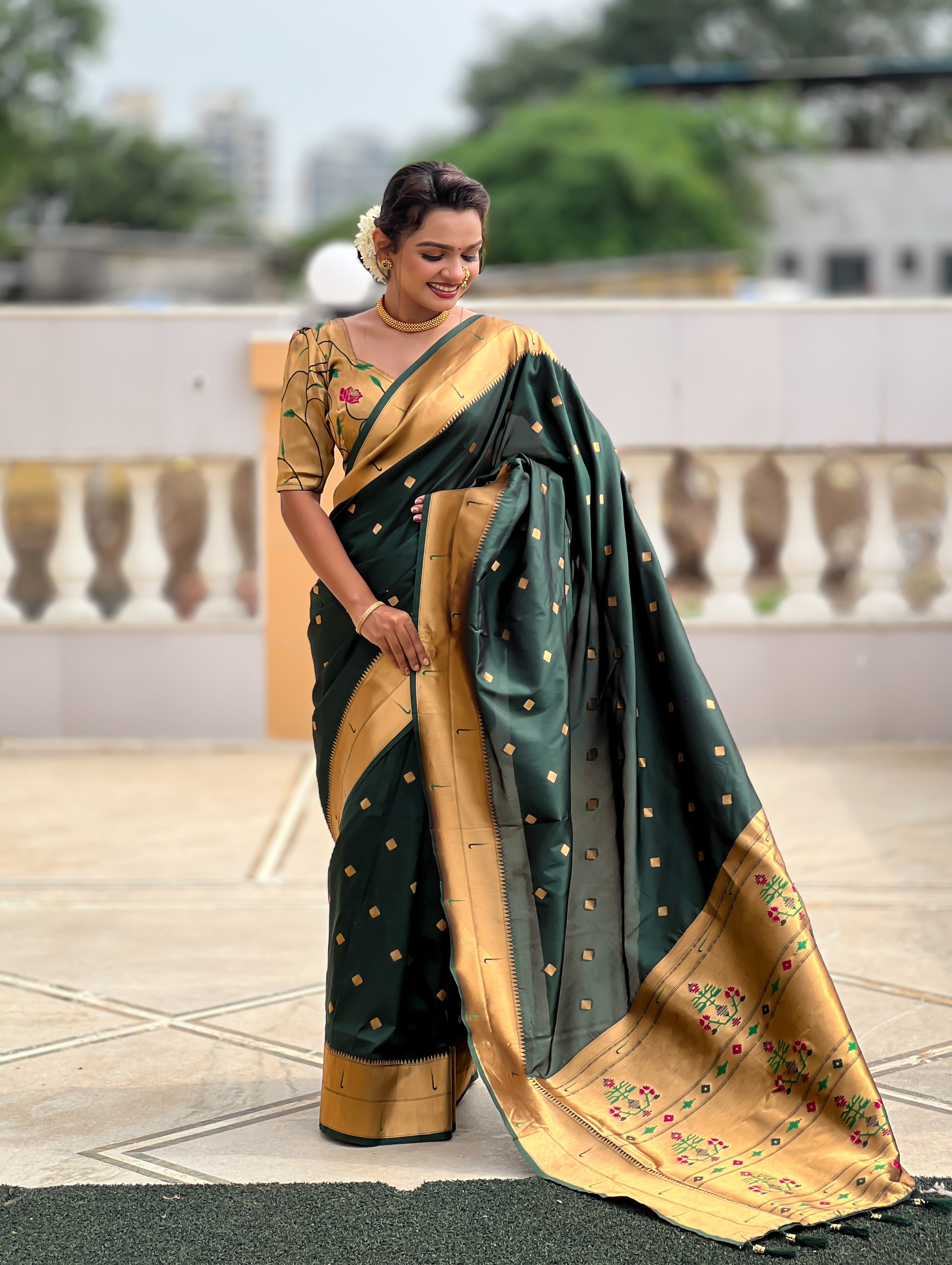 Woman wearing majestic Soft Paithani Silk Saree with Meenakari weaving and double munia border