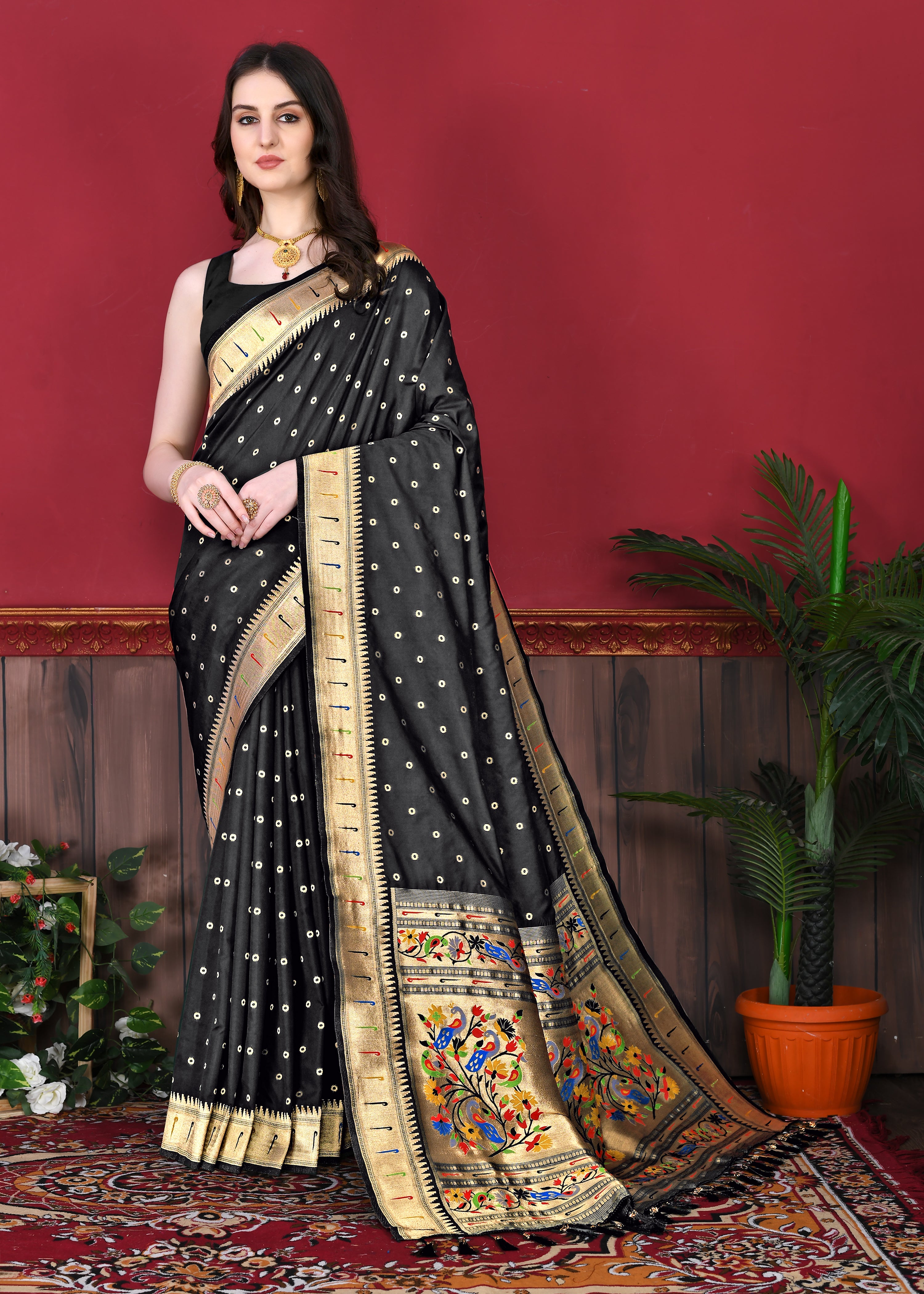 Model wearing Black Soft Paithani Silk Saree with gold zari Meenakari border and rich pallu for wedding