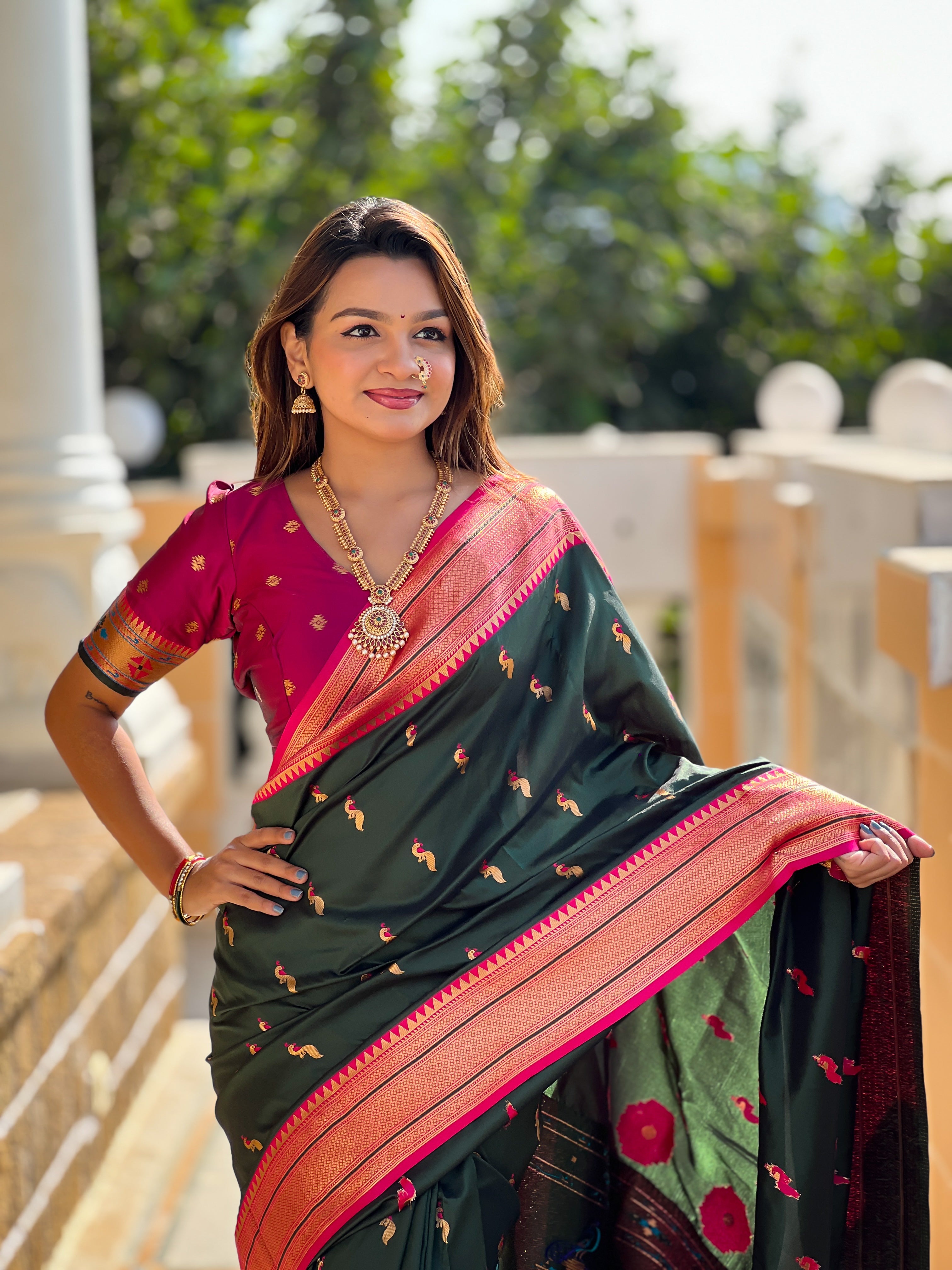 Woman wearing soft Paithani silk saree with meenakari zari border and rich pallu