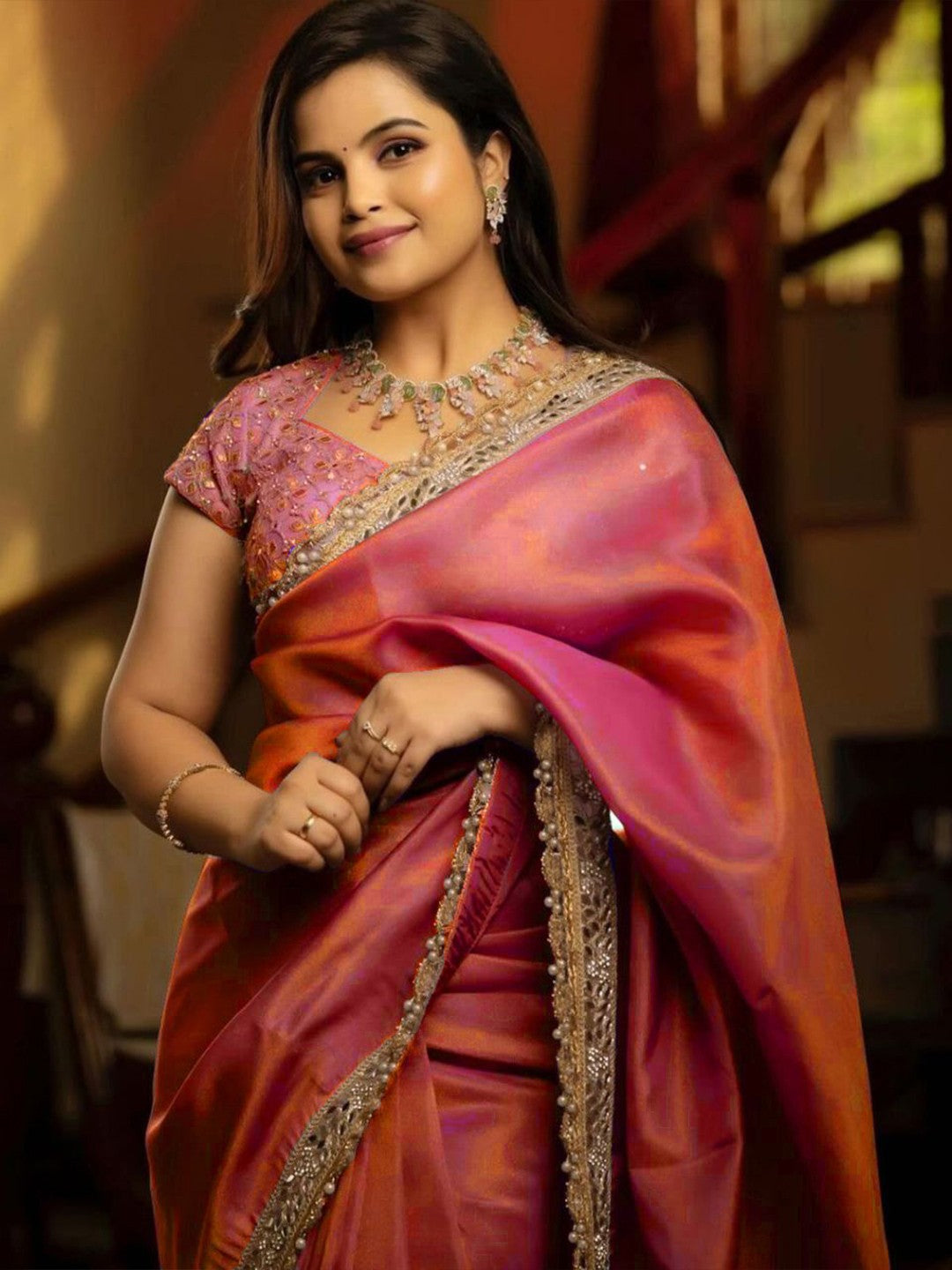 Silver tissue silk saree with real mirror work, zari dori embroidery and moti lace border worn by model