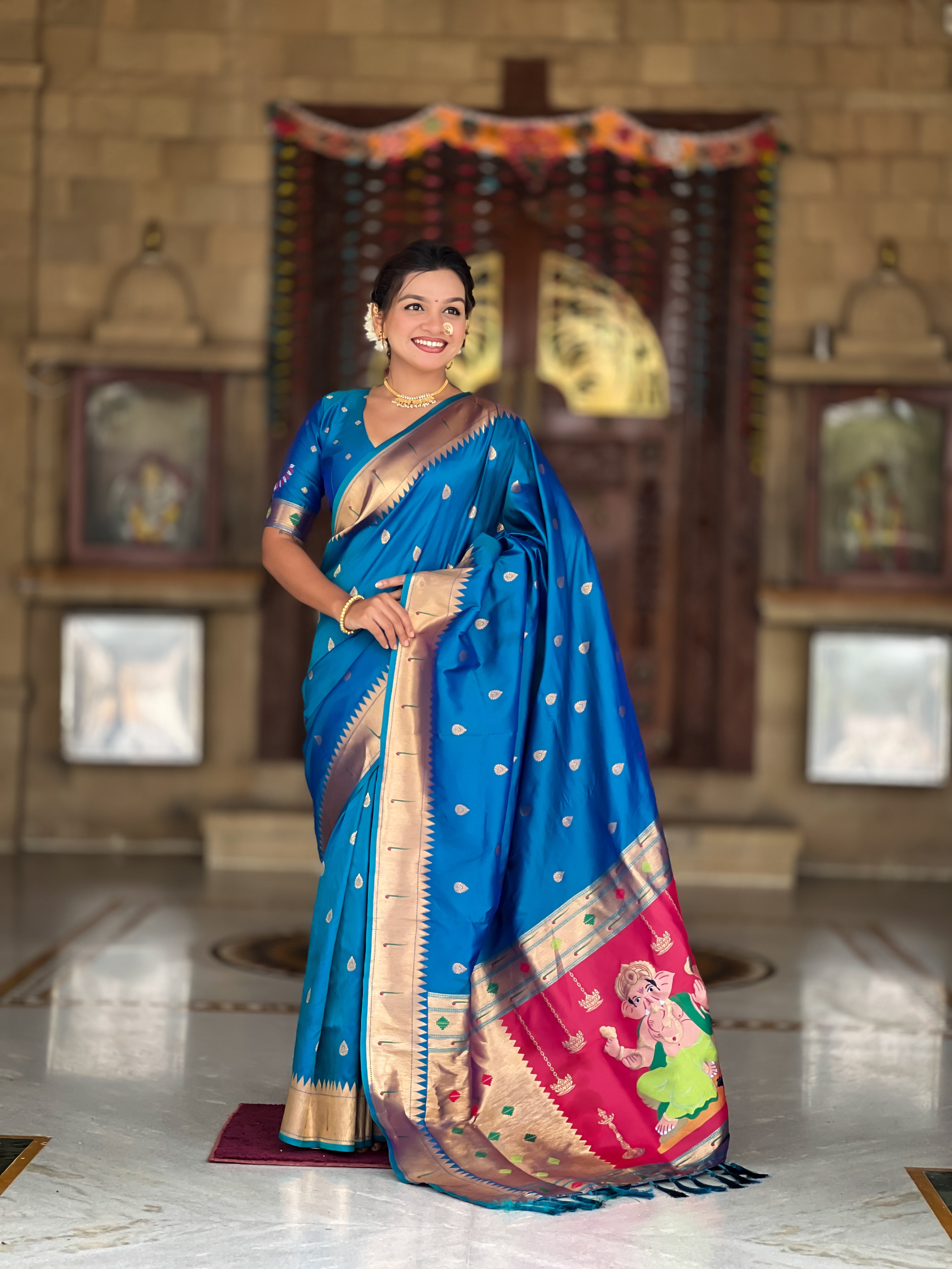 Soft Paithani Silk Saree; Pure Paithani Zari Weaving Motifs; Rich Meenakari Woven Pallu; Traditional Munia Border; Tassels on Pallu; Contrast Woven Silk Blouse with Sleeve Border