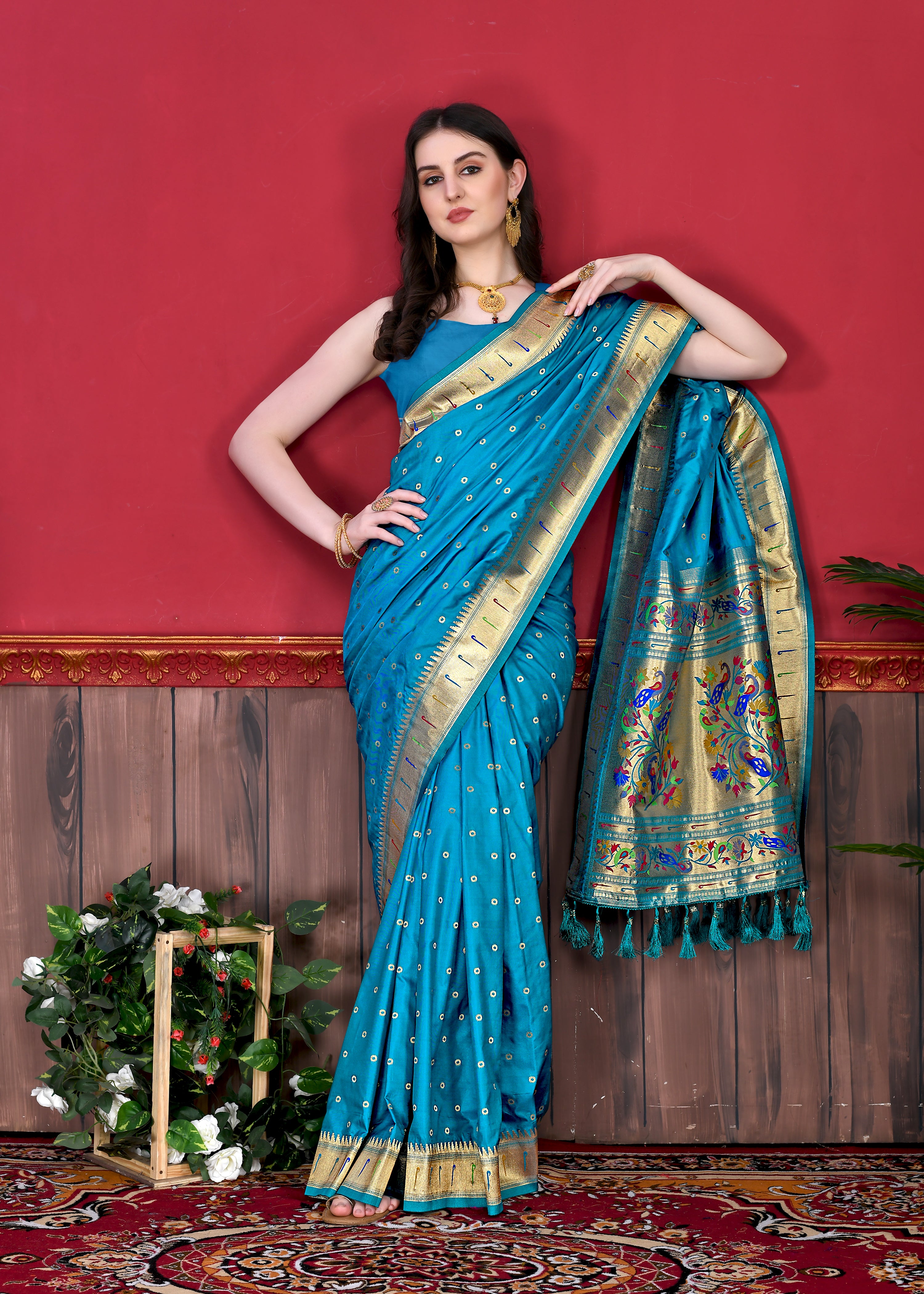 Model wearing Firozi Soft Paithani Silk Saree with gold zari Meenakari border and rich pallu for wedding
