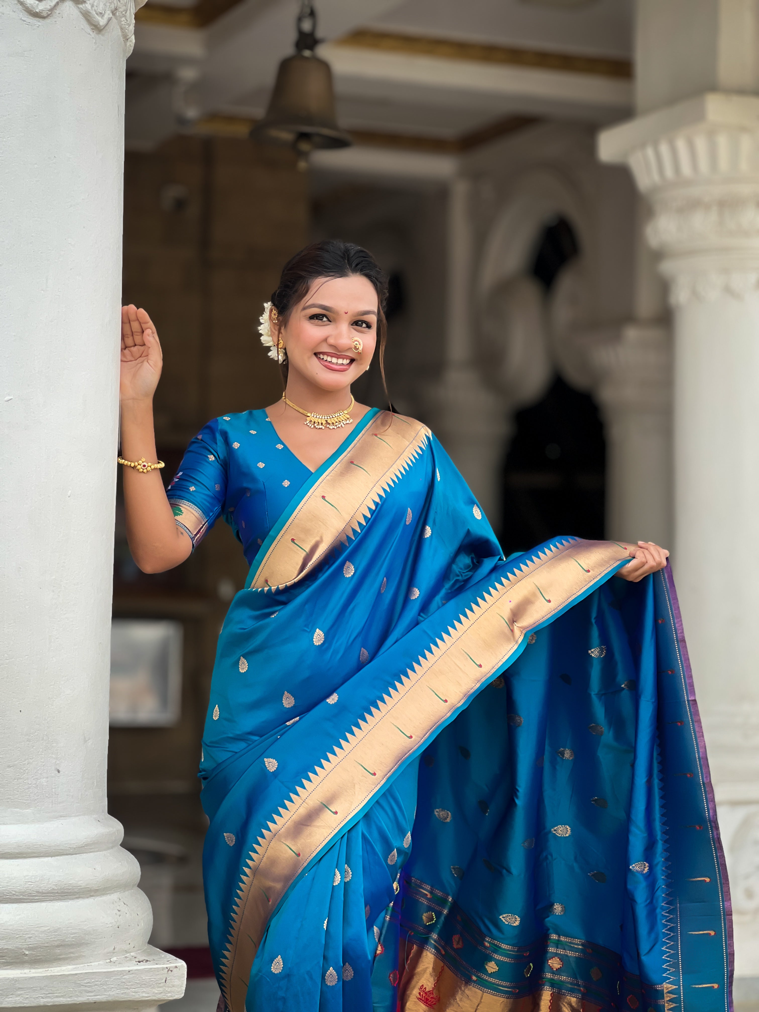 Soft Paithani Silk Saree; Pure Paithani Zari Weaving Motifs; Rich Meenakari Woven Pallu; Traditional Munia Border; Tassels on Pallu; Contrast Woven Silk Blouse with Sleeve Border