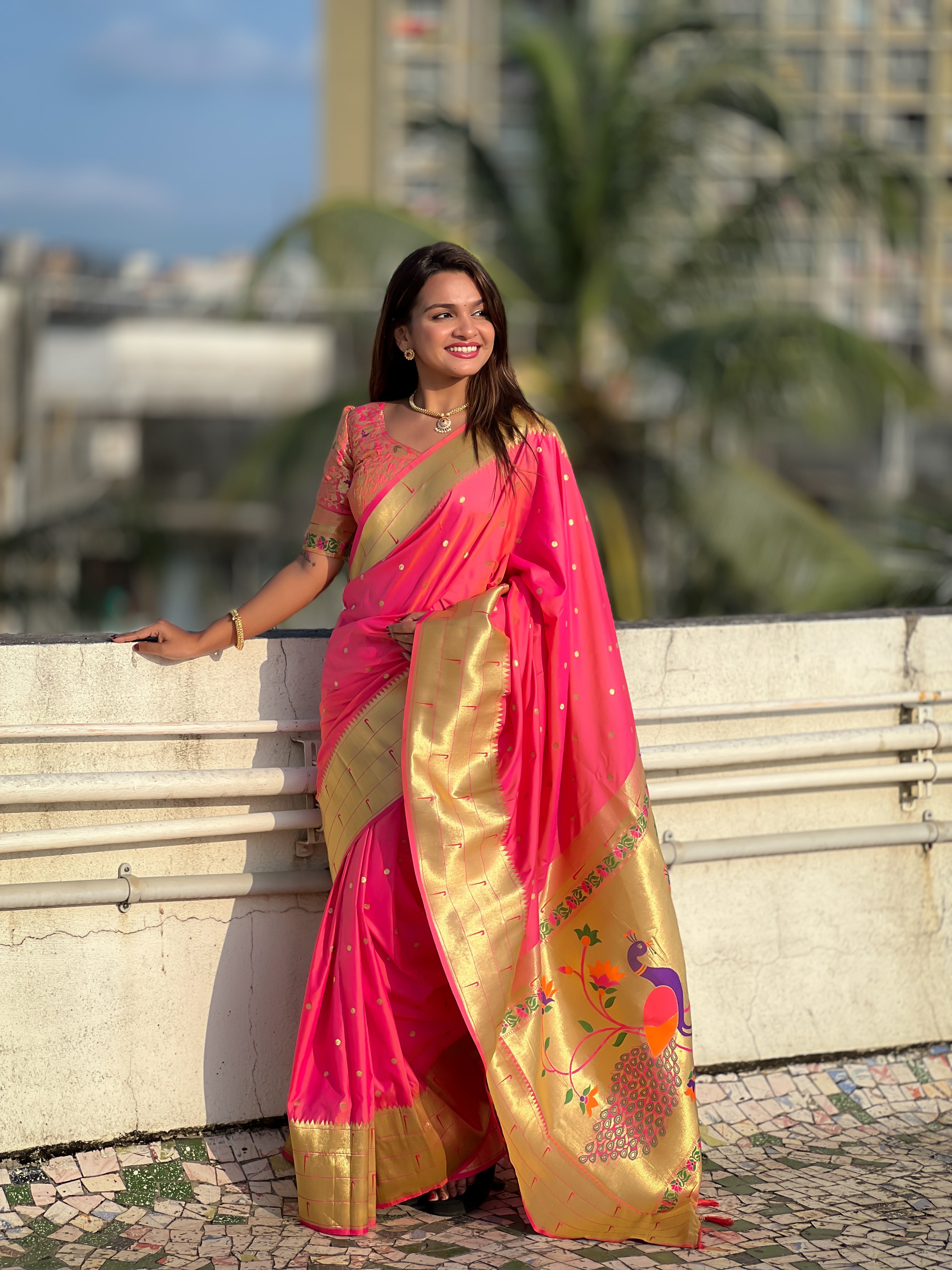 Model wearing Pink Soft Kanjivaram Paithani Silk Saree with Meenakari Zari weaving and rich swan border