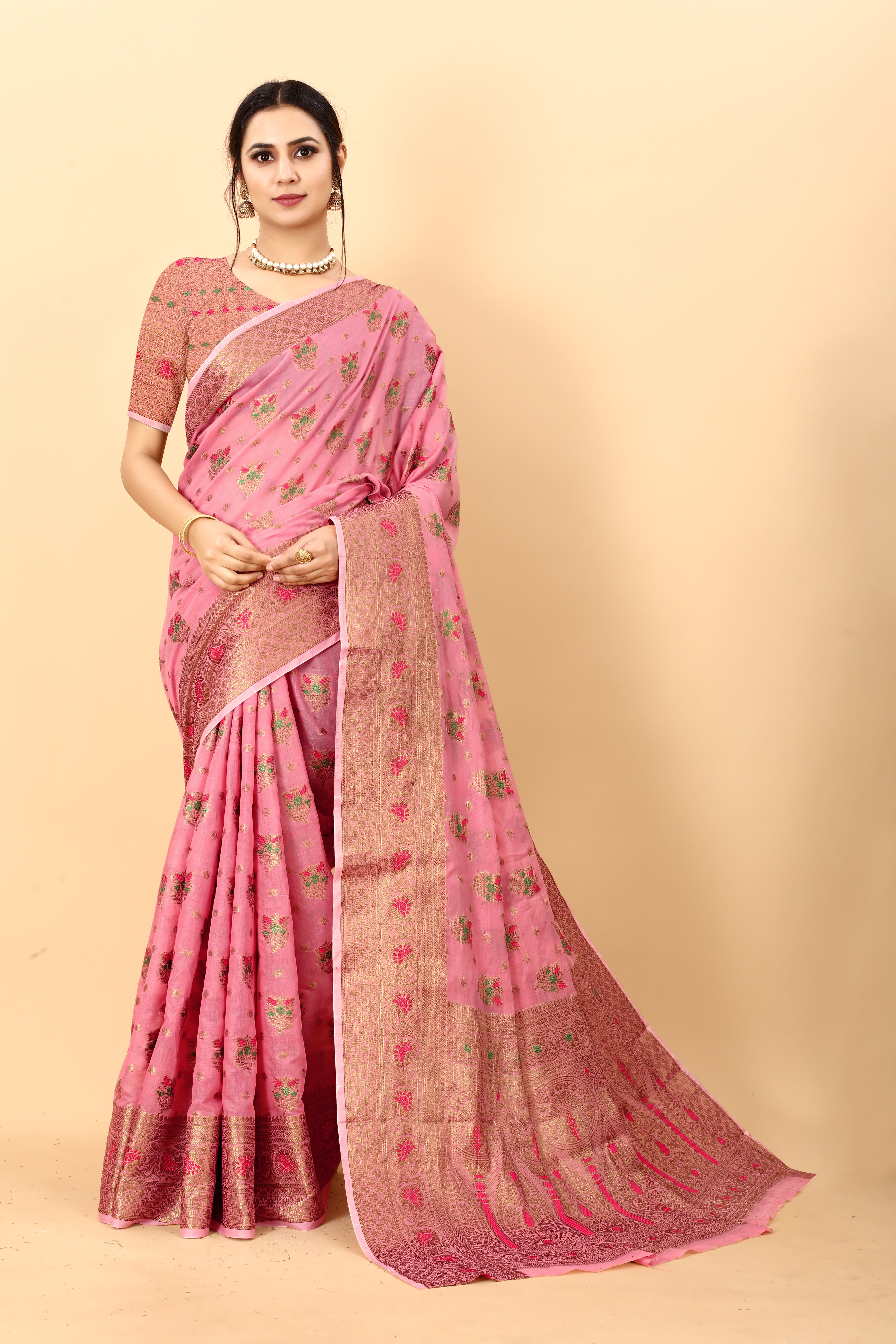 Model wearing Dark Pink soft cotton silk saree with rich golden zari woven pallu and floral motifs